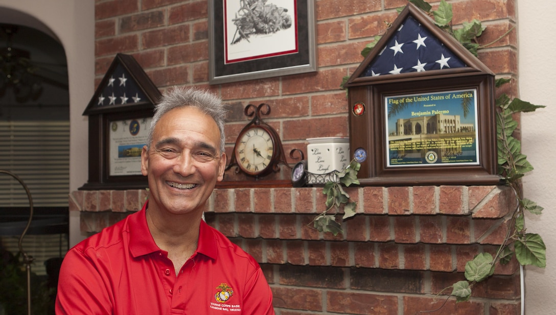 Benjamin "Ben" Palermo, a Marine Vietnam veteran ,  stands next to an American flag presented to him by his son, Nicholas Palermo a Marine veteran, in his home in San Antonio, Texas, June 4, 2015. Palermo served with H Company, 2nd Battalion, 4th Marine Regiment during Operation Starlite. 