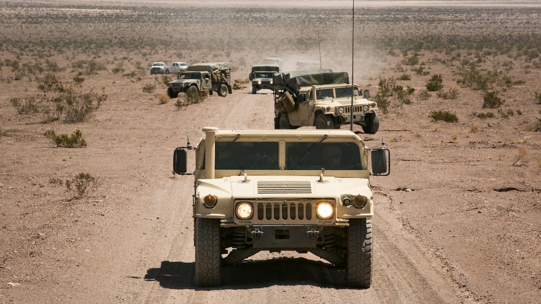 High Mobility Multipurpose Wheeled Vehicle operators with 1st Battalion, 3rd Marine Regiment, form a convoy during a live-fire and maneuver exercise in support of Large Scale Exercise 15 in the vicinity of the Blacktop Training Area, Aug. 15, 2015. 