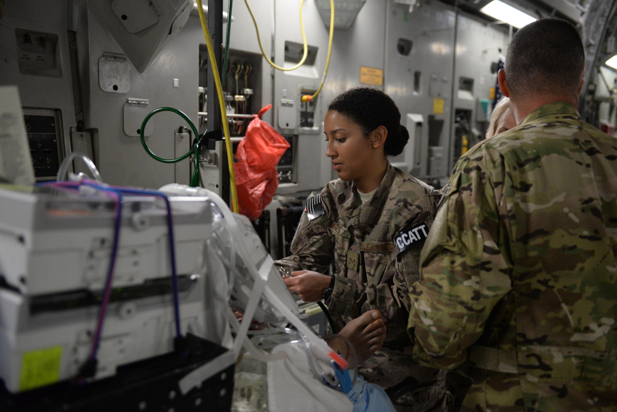 U.S. Air Force Senior Airman Natalie Hives, 455th Expeditionary Aeromedical Evacuation Squadron Critical Care Air Transport Team respiratory therapist deployed from the 60th Medical Group at Travis Air Force Base, California, sets up her equipment and checks on a patient prior to an aeromedical evacuation mission aboard a C-17 Globemaster III aircraft from Bagram Airfield, Afghanistan, to Ramstein Air Base, Germany, Aug. 8, 2015. The 455th EAES’ CCATT is a three-person, highly specialized medical team consisting of a physician who specializes in an area of critical care or emergency medicine, a critical care nurse and a respiratory therapist. The CCATT is charged with providing critical care to the sick and wounded as they are moved thousands of miles onboard U.S. cargo aircraft to receive full-time care elsewhere. (U.S. Air Force photo by Maj. Tony Wickman/Released)