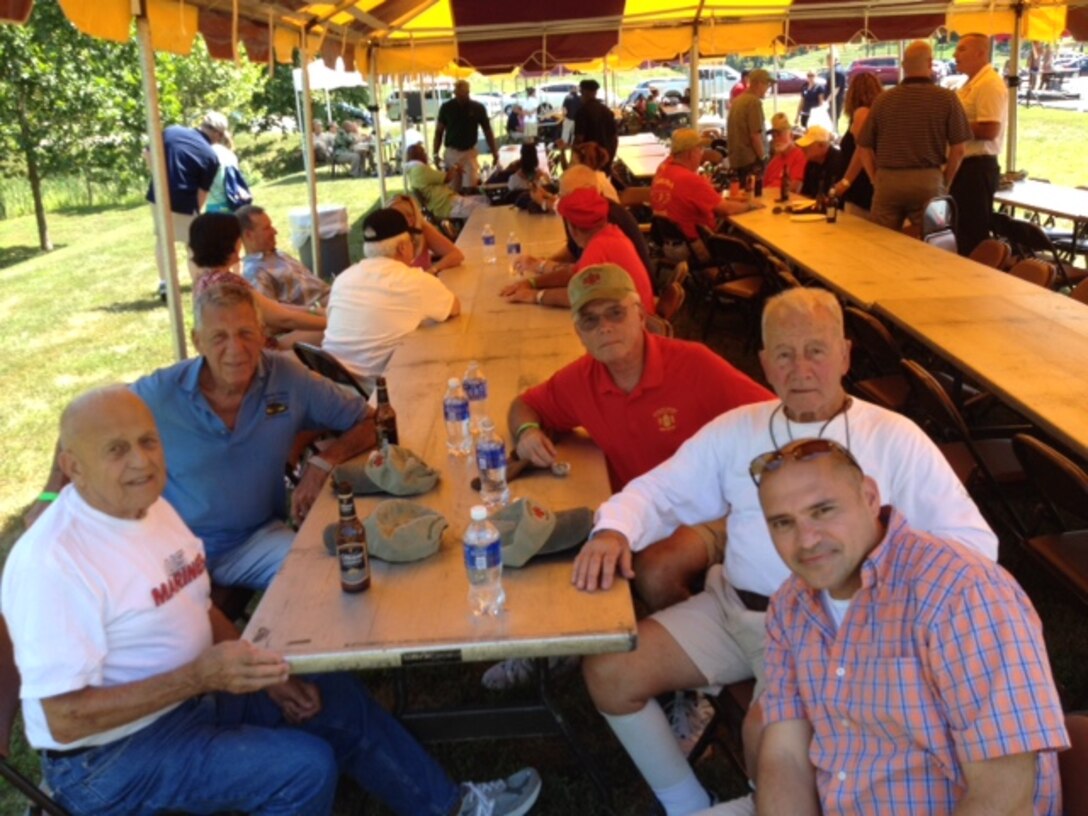 Left to right: Sgt. Maj. Marion Carcirieri, Master Gunnery Sgt. Mike Dugan, Master Gunnery Sgt. Les Boone, Sgt. Major Dominic Irrera and Sgt. Maj. George S. Sanchez have an opportunity to share war stories at the annual Sergeant Major of the Marine Corps Picnic held on Aug. 15 at the National Museum of the Marine Corps. These Marines served throughout several eras from WWII to Operation Iraqi Freedom.