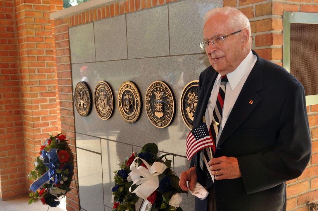Former U.S. Army Sgt. Charles Chapman, a 90-year-old WWII veteran, is honored at the Wreath Laying Ceremony to mark the 70th Anniversary of the end of WWII at the Quantico National Cemetery, Aug. 16. Chapman, a native of Harrisonburg, Va., joined the Army in 1943, and was assigned to the 69th Infantry Division Artillery. He was awarded the Bronze Star Medal for his service in 1945 on the Siegfried Line on the Belgium-German border.