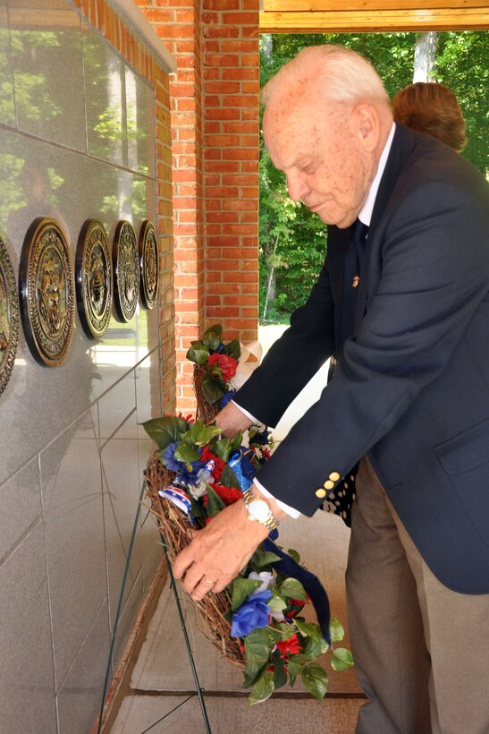 World War II veteran, retired U.S. Marine Corps Maj. John Elliott lays a memorial wreath at the WWII memorial site on 70th Anniversary of the end of WWII at the Quantico National Cemetery, Aug. 16. The event proclamation from the Prince William Board of County Supervisors read: The WWII generation created an array of organizations which helped to strengthen the American democracy by promoting civic engagement, volunteerism, and service to the community. The military and civilian personnel have provided a model of unity that serves as a source of inspiration to future generations of America to come together to work together to work for the continued betterment of the U.S.