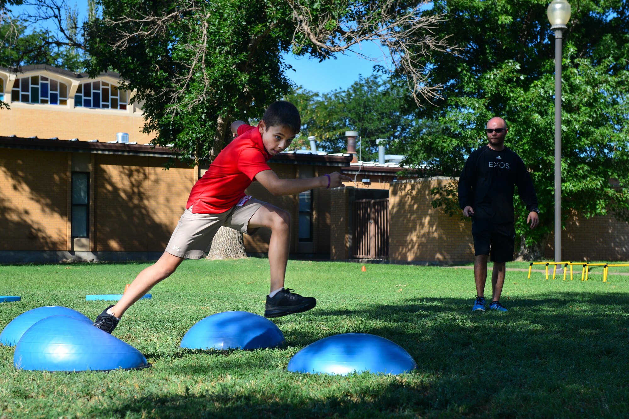 A young Air Commando tackles the obstacle course at the Student Connections Round-Up Aug. 13, 2015 at Cannon Air Force Base, N.M. The Round-Up was designed to improve quality of life for Cannon kids, creating an environment where they could learn new skills and make new friends before their first day of school. (U.S. Air Force photo/Airman 1st Class Shelby Kay-Fantozzi)