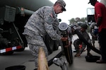 A motor transport operator with the Army Reserve’s 705th Transportation Company prepares to offload his fuel carrier June 12 during the Quartermaster Liquid Logistics Exercise at Fort Bragg, North Carolina. QLLEX is an annual logistical movement event in which service members transport petroleum and purified water throughout the U.S. 