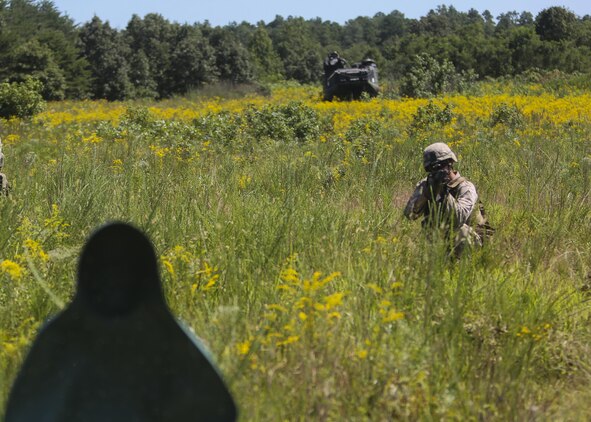 A Marine with Alpha Company, 2nd Combat Engineer Battalion, advances toward the enemy position during a platoon fire and maneuver range at Fort A.P. Hill, Va., Aug. 13, 2015. The platoons put everything they had learned so far during the deployment for training exercise to the test by using both their provisional infantry and combat engineering skills during the culminating event. (U.S. Marine Corps photo by Cpl. Michelle Reif/Released)