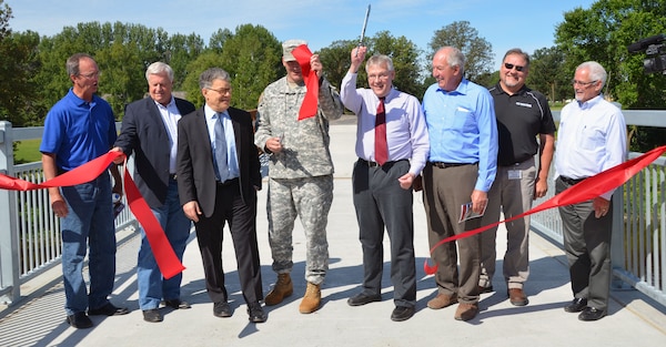 The U.S. Army Corps of Engineers, along with Roseau Mayor Jeffry Pelowski, U.S. Sen. Al Franken, U.S. Rep. Collin Peterson, state Sen. LeRoy Stumpf, state Rep. Dan Fabian, Minnesota Department of Natural Resources representative Kent Lokkesmoe and Mark Karl of Polaris Industries, dedicated the Roseau Flood Risk Management project August 18, 2015. The $44.6 million project includes a 4.5 mile diversion channel and 45 acres of recreation opportunities to include three birding sites, 9 miles of off-road vehicle trails, an ATV challenge course, 7 miles of multi-use trails and a trail head with parking and picnic area. The diversion channel was designed to divert floodwater around the city to reduce flood stages within the community.