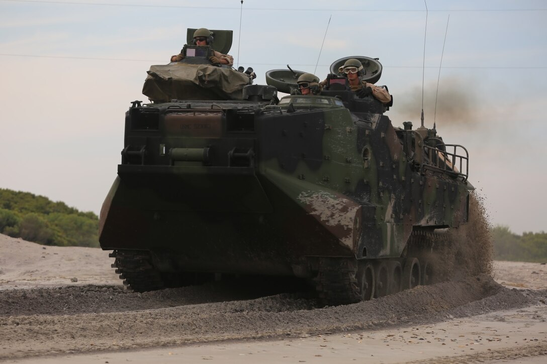 An amphibious assault vehicle with 1st Platoon, Bravo Company, 2nd Assault Amphibian Battalion makes its way to the beach prior to pushing through the surf on Onslow Beach aboard Camp Lejeune, N.C. Aug. 17, 2015. AAV’s are made for the purpose of going from ship to shore and back with ease. (U.S. Marine Corps photo by Pfc. Miranda Faughn/Released)