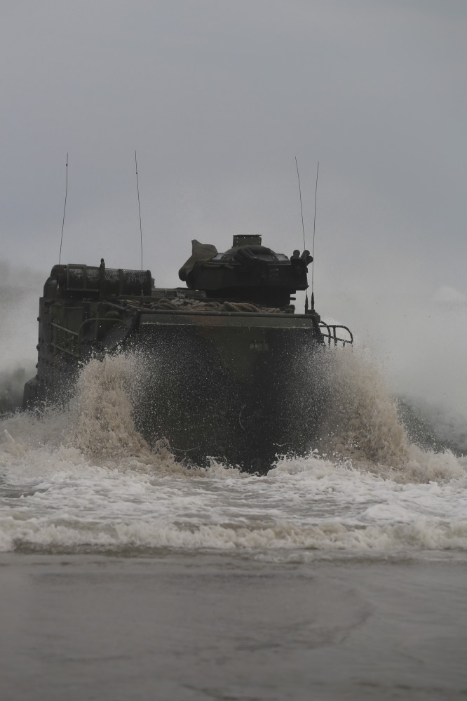 An amphibious assault vehicle with 1st Platoon, Bravo Company, 2nd Assault Amphibian Battalion makes its way through the waves to make a 500-1000 meter out gator square as part of a training exercise conducted on Onslow Beach aboard Camp Lejeune, N.C. Aug. 17, 2015. “The AAV is what keeps the Marine Corps amphibious,” said Cpl. Tomas Martinez, a Crew Chief with 1st Platoon, Bravo Company, 2nd Assault Amphibian Battalion. (U.S. Marine Corps photo by Pfc. Miranda Faughn/Released)