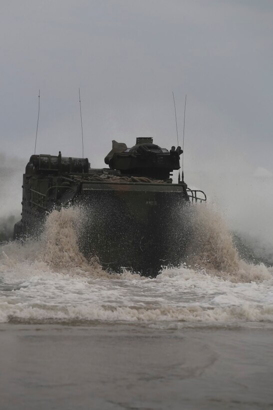 An amphibious assault vehicle with 1st Platoon, Bravo Company, 2nd Assault Amphibian Battalion makes its way through the waves to make a 500-1000 meter out gator square as part of a training exercise conducted on Onslow Beach aboard Camp Lejeune, N.C. Aug. 17, 2015. “The AAV is what keeps the Marine Corps amphibious,” said Cpl. Tomas Martinez, a Crew Chief with 1st Platoon, Bravo Company, 2nd Assault Amphibian Battalion. (U.S. Marine Corps photo by Pfc. Miranda Faughn/Released)