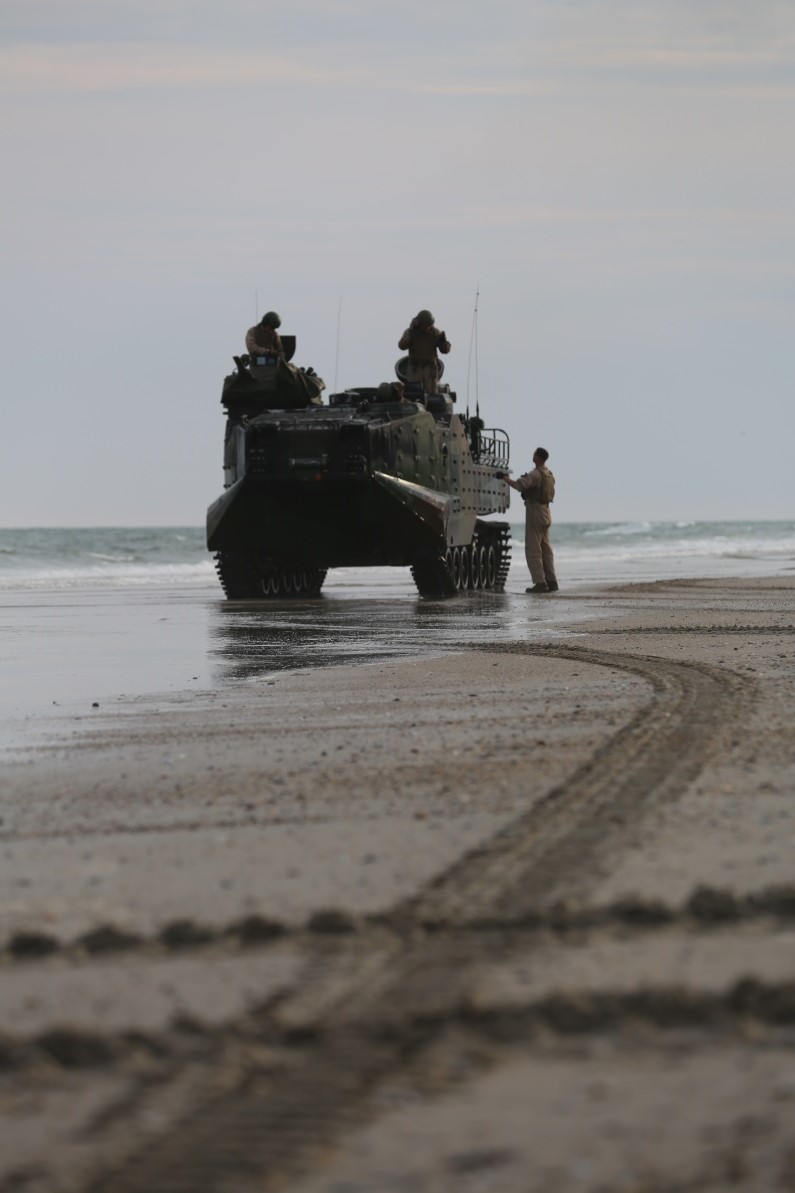 After completing the first part of the exercise, an amphibious assault vehicle with 1st Platoon, Bravo Company, 2nd Assault Amphibian Battalion stopped to make sure everything is still working properly aboard Camp Lejeune, N.C. Aug. 17, 2015. All members of each section that man the AAVs are required to know how to maintain the machine and to keep them in working order. (U.S. Marine Corps photo by Pfc. Miranda Faughn/Released)