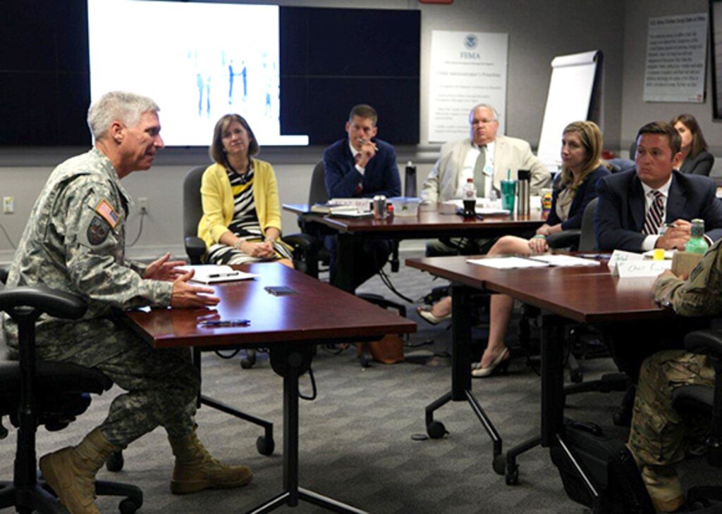 Jerad McIntyre (Right), a civil engineer with the Special Projects Program, Engineering and Support Center, Huntsville, listens with fellow U.S. Army Corps of Engineers emerging leaders as speakerMaj. Gen. Richard Stevens (Left), Deputy Chief of Engineers and Deputy Commanding General, discusses Corps-wide issues during the Executive Governance Meeting in Washington, District of Columbia, Aug. 3-7. McIntyre was named the 2015 Emerging Leader for Huntsville Center in July. 

