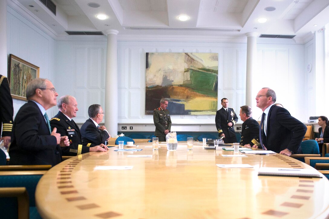 U.S. Army Gen. Martin E. Dempsey, second on left, chairman of the Joint Chiefs of Staff,  and U.S. Ambassador to Ireland Kevin O'Malley, left, meet with Irish Defense Minister Simon Coveney, right, at Ireland's Defense Ministry in Dublin, Aug. 20, 2015. DoD photo by D. Myles Cullen