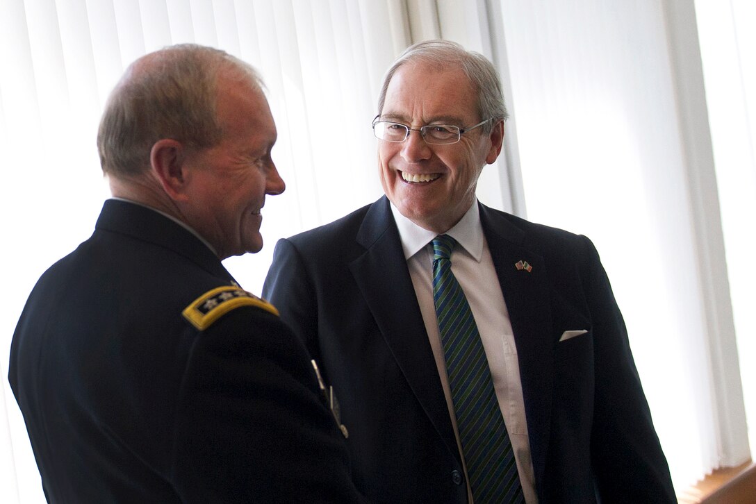 U.S. Army Gen. Martin E. Dempsey, chairman of the Joint Chiefs of Staff, meets with Kevin O'Malley, right, U.S. Ambassador to Ireland, at the U.S. Embassy in Dublin, Aug. 18, 2015. 