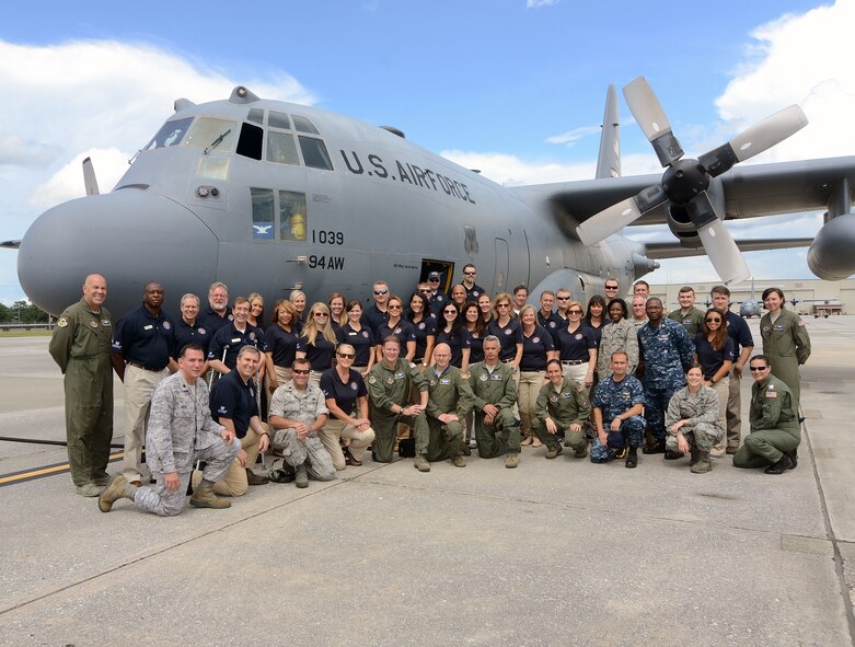 Members of the Honorary Commanders Association Class of 2015 learned more about the mission of the 94th Airlift Wing as they flew on a C-130 during their annual Dobbins Day, at Dobbins Air Reserve Base, Ga.  Aug. 20. The HCA class poses here with members Dobbins leadership and flight crew members after the flight. (U.S. Air Force photo by Don Peek)