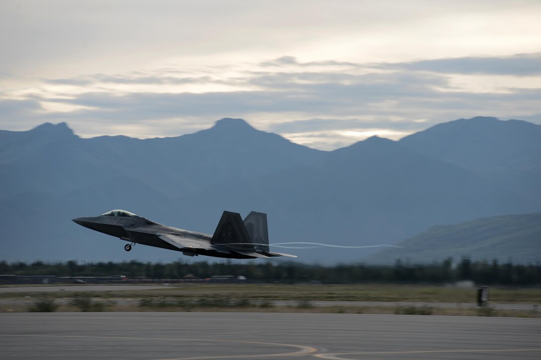 An F-22 Raptor takes off during Red Flag-Alaska at Joint Base Elmendorf-Richardson, Alaska, Aug. 10, 2015. RF-A is an exercise that provides joint offensive counter-air, interdiction, close air support and large force employment training in a simulated combat environment. More than 20 allied countries have participated in RF-A since its conception, improving integration, interoperability and cross-cultural competence. (U.S. Air Force photo/Staff Sgt. Cody H. Ramirez)