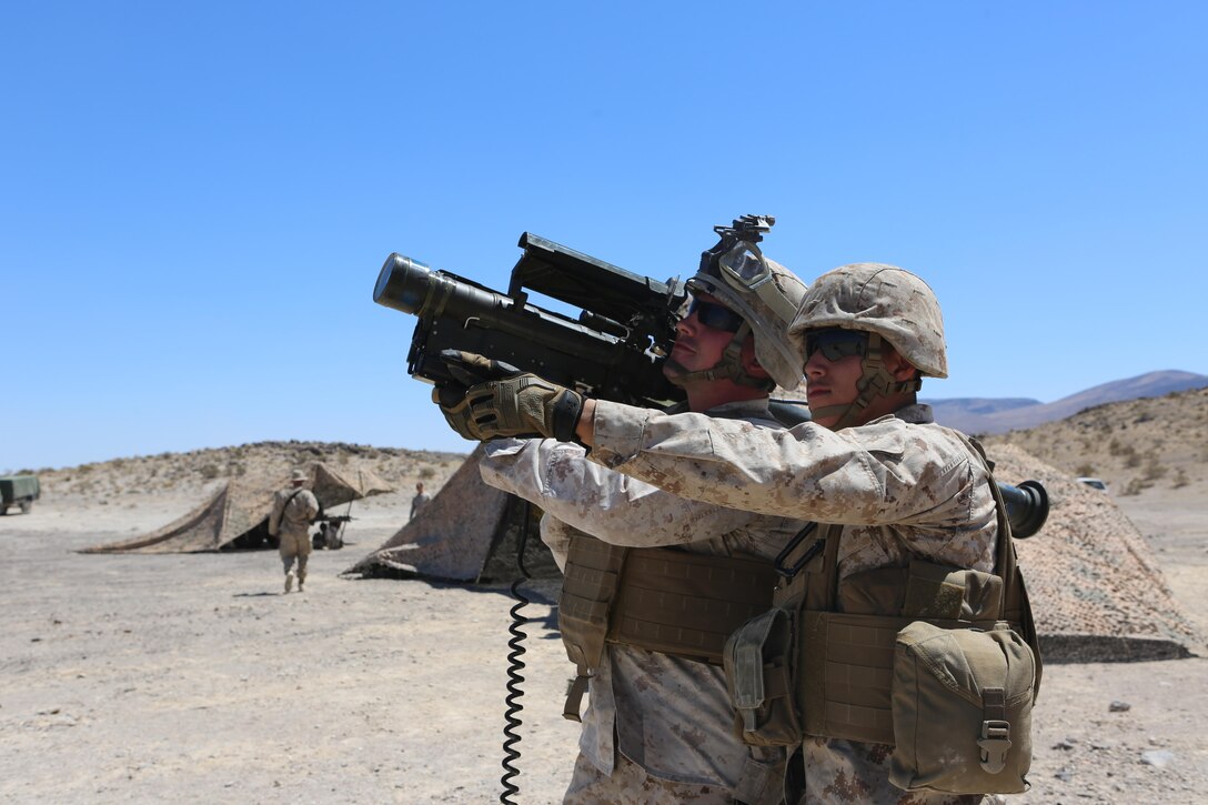 Marines with 3rd Low Altitude Air Defense Battalion, Marine Air Control Group 38, 3rd Marine Air Wing, practice sighting the Stinger in preparation for a Stinger missile fire exercise, Aug. 9, 2015, aboard National Training Center Fort Irwin, Calif. During the exercise, Marines fired 60 Stinger missiles at remote-controlled airplanes to simulate a realistic encounter. (U.S. Marine Corps photo by Lance Cpl. April L. Price/Released)