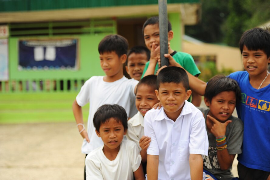Children from Dao Elementary School stand outside their class room Bohol Provence, Philippines, Aug. 20, 2015. Dao Elementary is one of six schools repaired by the U.S. Air Force, U.S. Army and U.S. Marine Corps along with service members from the Philippines and Australia. Pacific Angel is a multilateral humanitarian assistance civil military operation, which improves military-to-military partnerships in the Pacific while also providing medical health outreach, civic engineering projects and subject matter exchanges among partner forces. (U.S. Air Force photo by Tech. Sgt. Aaron Oelrich/Released)