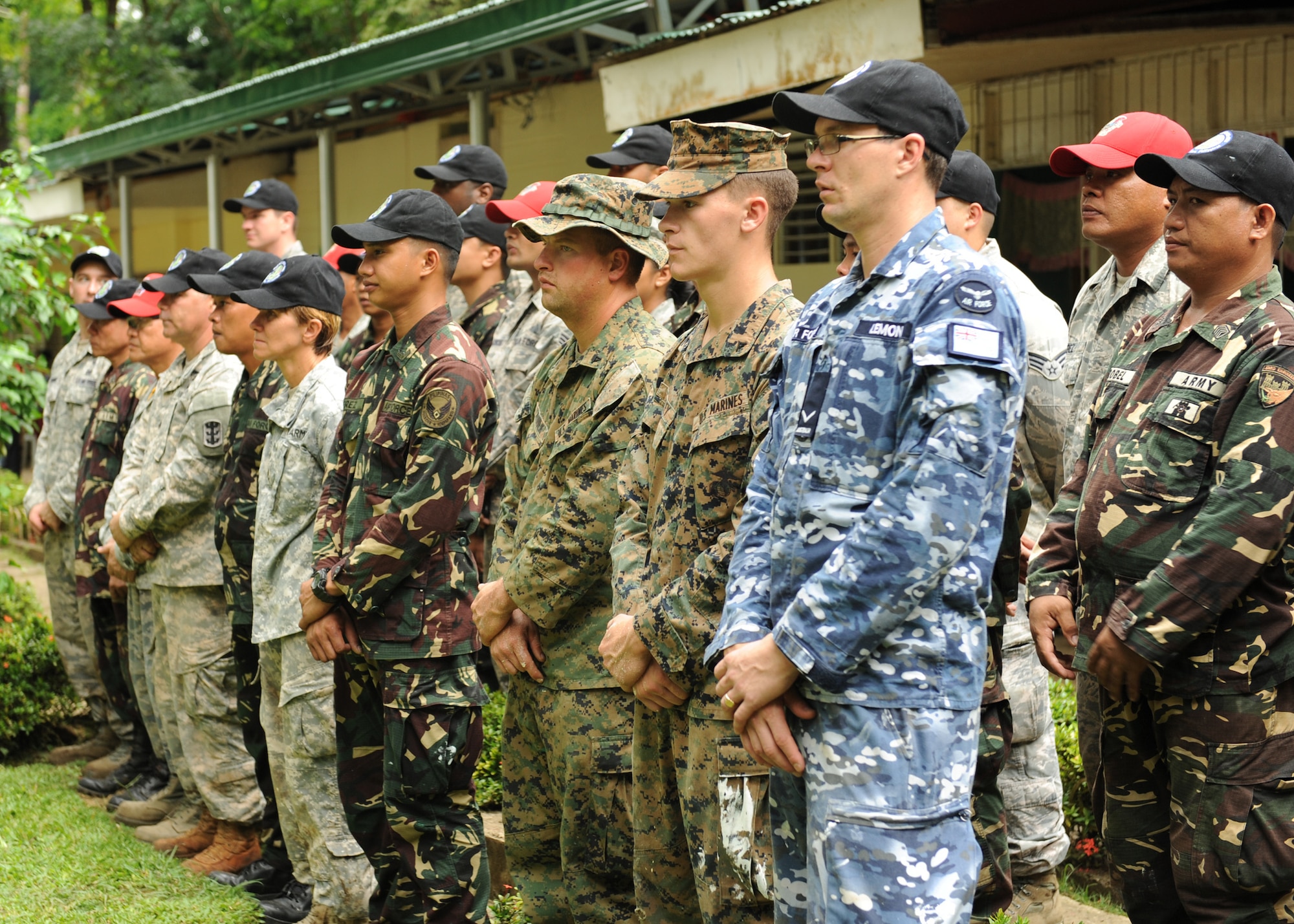 Members of Pacific Angel Philippines’ engineering civic action project stand, as students from Bartolome Doria Elementary present a token of gratitude after the U.S. Air Force, U.S. Army and U.S. Marine Corps along with service members from the Philippines and Australia made repairs to their school as a part of Pacific Angele Philippines in Bohol Provence, Philippines, Aug. 16, 2015. Pacific Angel is a multilateral humanitarian assistance civil military operation, which improves military-to-military partnerships in the Pacific while also providing medical health outreach, civic engineering projects and subject matter exchanges among partner forces.(U.S. Air Force photo by Tech. Sgt. Aaron Oelrich/Released)