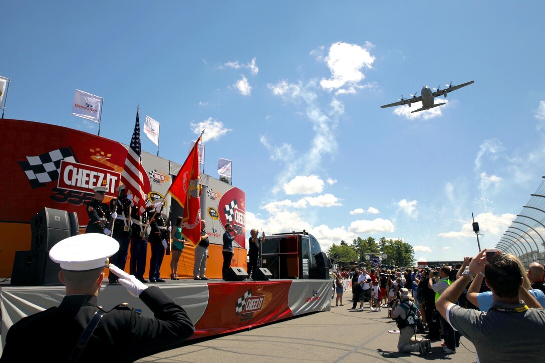 A U.S. Marine Corps Color Guard participates in the opening ceremony of the Cheez-It 355 NASCAR Sprint Cup at Watkins Glen International, Aug. 9. The Marines, from Recruiting Station Buffalo, also conducted a swearing-in ceremony for 14 poolees and drove an H1 Humvee on the track as part of the race day festivities. (Official U.S. Marine Corps photo by Sgt. Christopher O’Quin/Released)