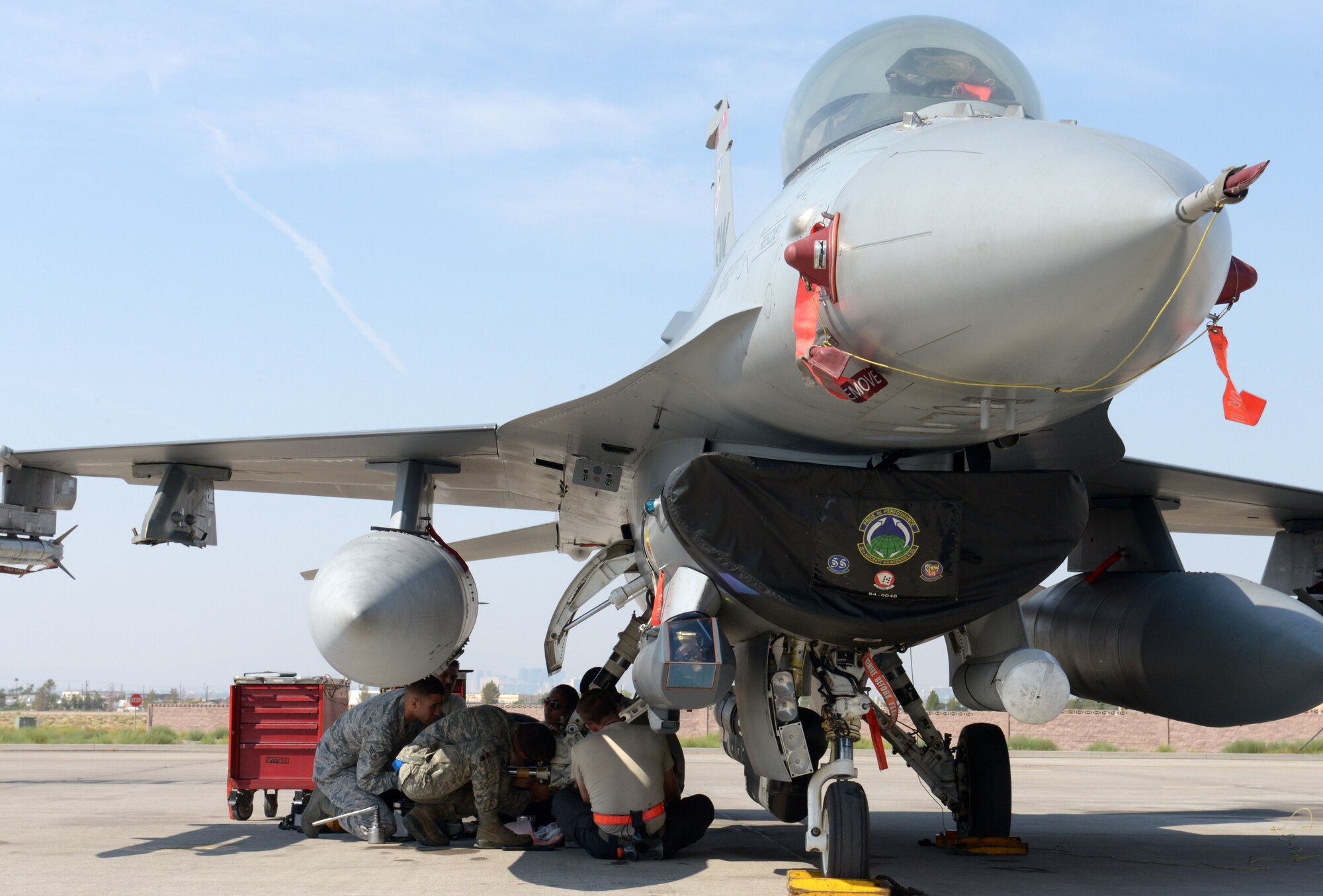 Maintainers assigned to the 20th Aircraft Maintanence Squadron, Shaw Air Force Base, S.C., work on a component of an F-16 Fighting Falcon during Red Flag 15-4 at Nellis AFB, Nev., Aug. 19, 2015. Maintainers are trained to accomplish intermediate-level maintenance on aircraft and support equipment components; maintaining avionics, laser guided weapons systems, fuel systems, engines, measurement/diagnostic equipment, electro-environmental, and egress systems. (U.S. Air Force photo by Airman 1st Class Mikaley Towle)