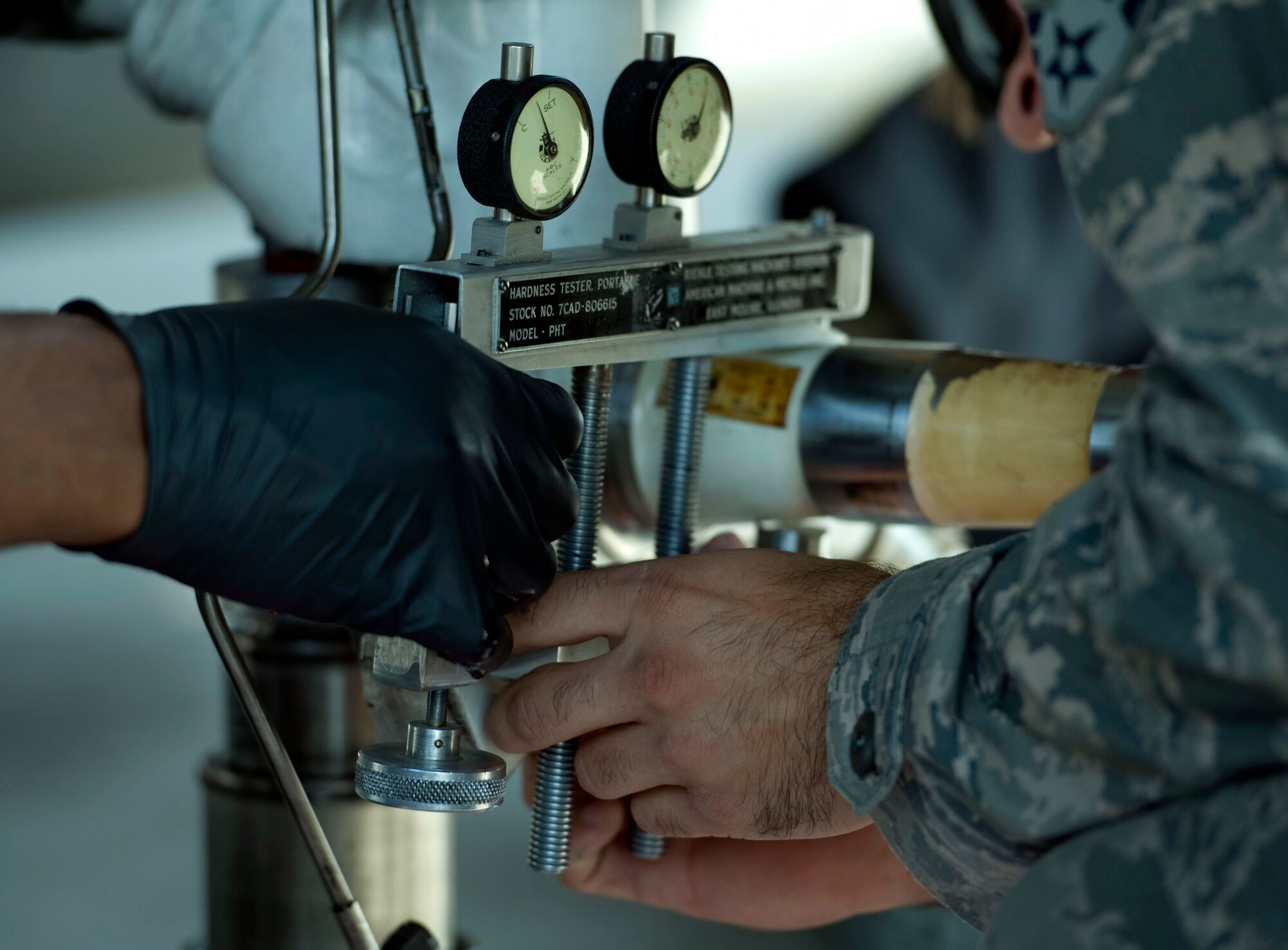 Senior Airmen John Abbott and Jordan Cotton, both maintainers assigned to the 20th Aircraft Maintanence Squadron, Shaw Air Force Base, S.C., perform a caliber test on an F-16 Fighting Falcon’s landing gear during Red Flag 15-4 at Nellis AFB, Nev., Aug. 19, 2015. The caliber test was performed to ensure the maintainers could successfully change the aircraft’s landing gear tire. (U.S. Air Force photo by Airman1st Class Rachel Loftis)