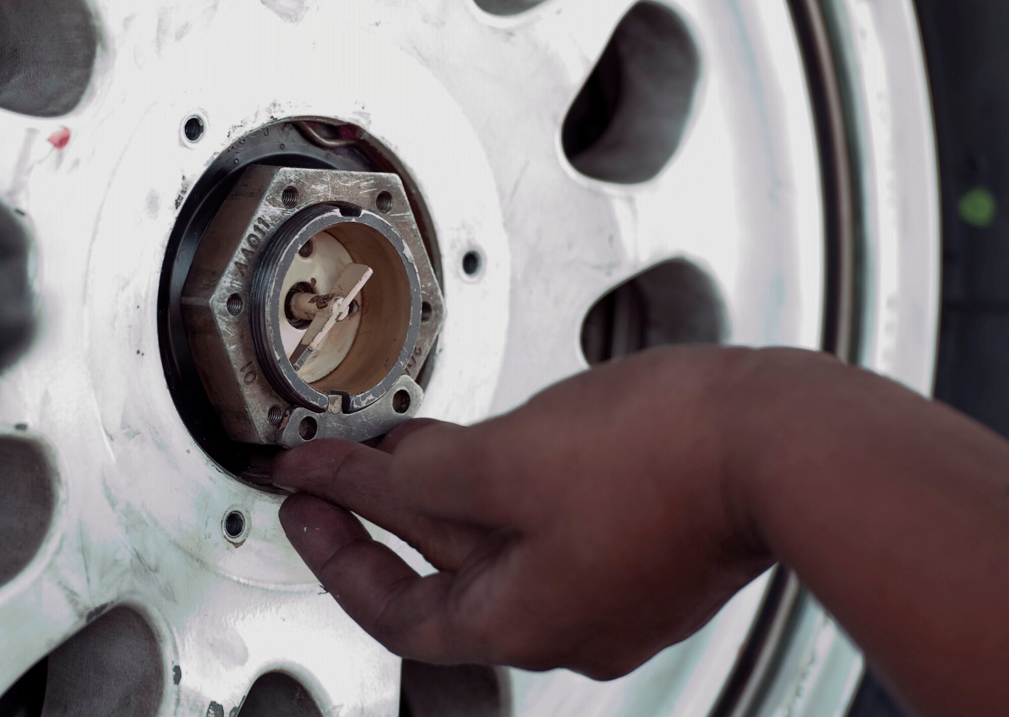 Staff Sgt. Ashley Grugin, a maintainer assigned to the 20th Aircraft Maintanence Squadron, Shaw Air Force Base, S.C., works on changing a landing gear tire on an F-16 Fighting Falcon during Red Flag 15-4 at Nellis AFB, Nev., Aug. 19, 2015. Red Flag provides a series of intense air-to-air scenarios for aircrew and ground personnel to increase their combat readiness and effectiveness for future real-world operations.  (U.S. Air Force photo by Airman 1st Class Rachel Loftis)