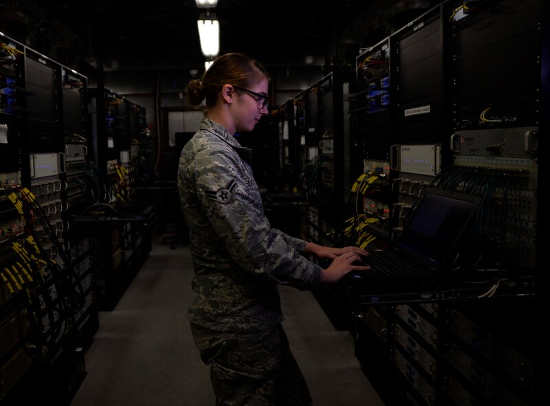 Airman 1st Class Ashley Kellar, 432nd Aircraft Communications Maintenance Squadron radio frequencies transmission technician checks a control monitor and alarm computer for discrepancies  Aug. 19, 2015, at Creech Air Force Base, Nevada. The ACMS is responsible for maintaining all communications equipment needed to fly both the MQ-1 Predator and MQ-9 Reaper remotely piloted aircraft. (U.S. Air Force photo by Airman 1st Class Christian Clausen/Released)