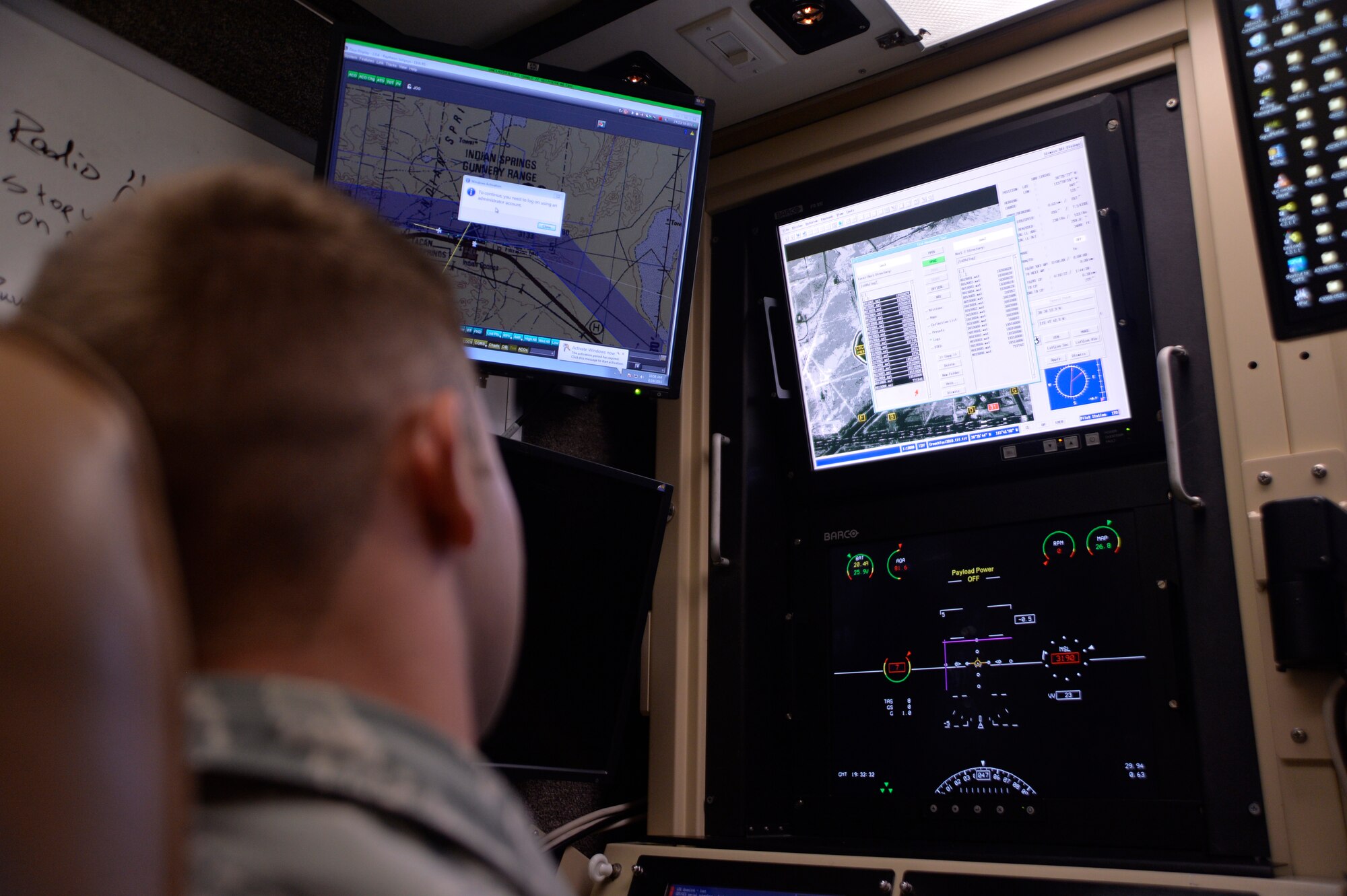 Airman 1st Class John Behrens, 432nd Aircraft Communication Maintenance Squadron remotely piloted aircraft communications technician, resets the data logs of a ground control station used to fly both the MQ-1 Predator and MQ-9 Reaper aircraft Aug. 19, 2015, at Creech Air Force Base, Nevada. Resetting the logs is a basic post-flight procedure to ensure all data is stored properly. The 432nd ACMS is the only unit of its kind in the Air Force dedicated to maintaining the communications network for the RPA enterprise. (U.S. Air Force photo by Airman 1st Class Christian Clausen/Released)