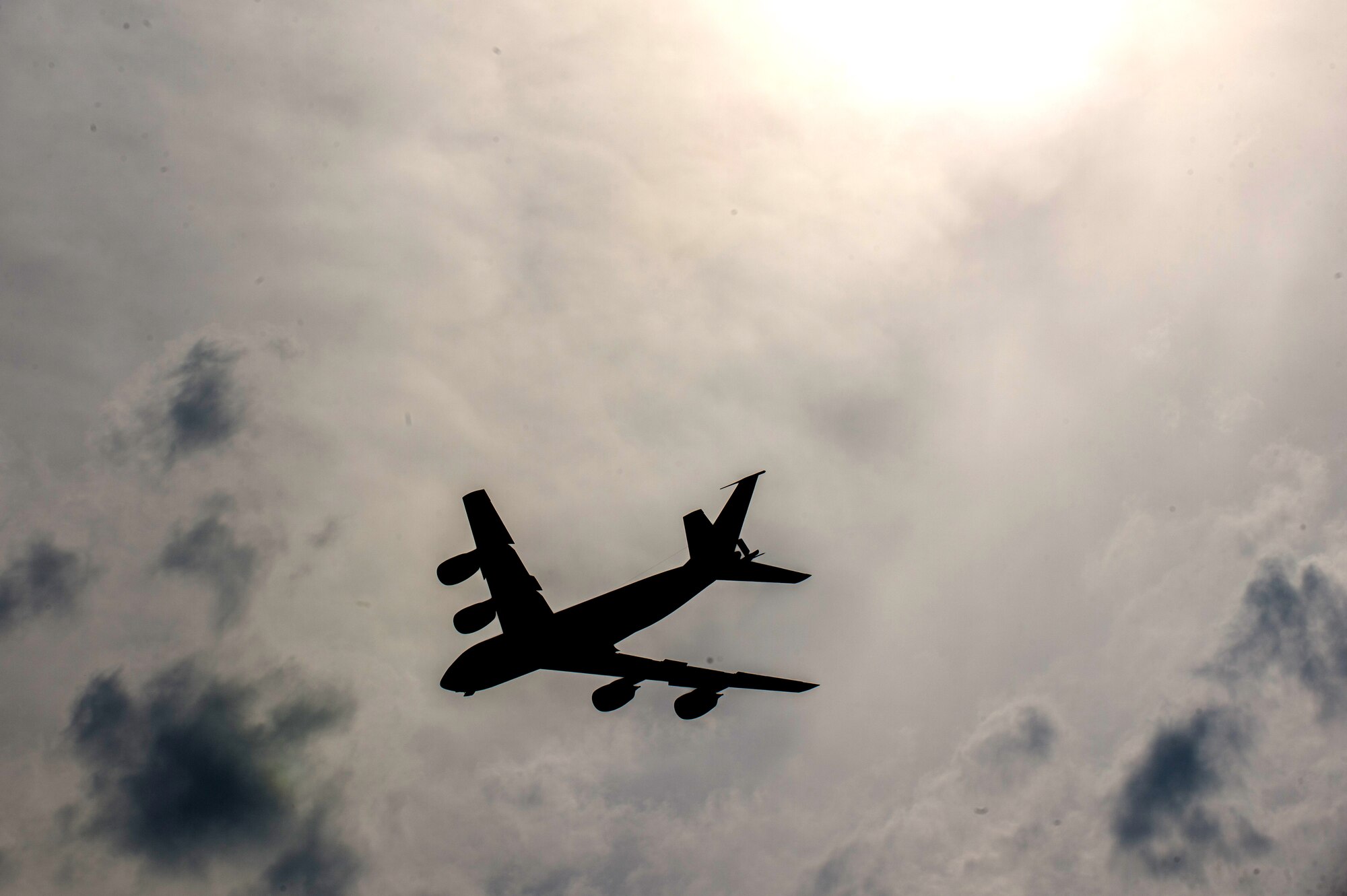 A U.S. Air Force KC-135 Stratotanker flies over Eielson Air Force Base, Alaska, Aug. 14, 2015, during RED FLAG-Alaska (RF-A) 15-3. Tanker, transport, fighter and electronic warfare aircraft from multiple countries, service branches, and units are deployed to Eielson for RF-A, a series of Pacific Air Forces commander-directed field training exercises for U.S. and partner nation forces, providing combined offensive counter-air, interdiction, close air support, and large force employment training in a simulated combat environment. (U.S. Air Force photo by Staff Sgt. Shawn Nickel/Released)