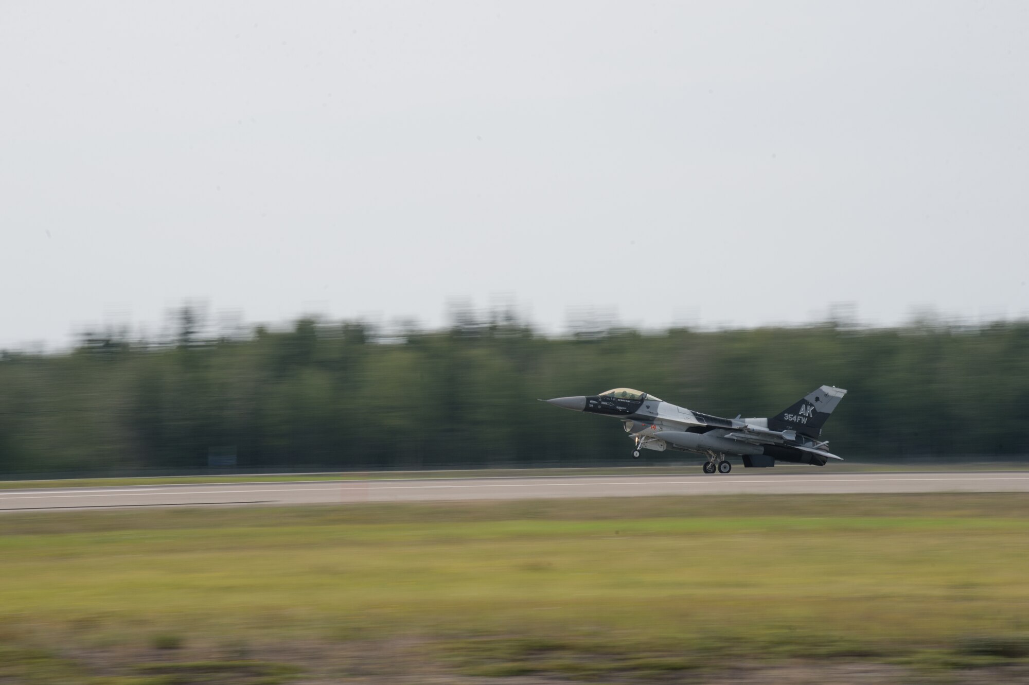 A U.S. Air Force F-16 Fighting Falcon assigned to the 18th Aggressor Squadron takes off from Eielson Air Force Base, Alaska, Aug. 14, 2015, during RED FLAG-Alaska (RF-A) 15-3. RF-A is a series of Pacific Air Forces commander-directed field training exercises for U.S. and partner nation forces, providing combined offensive counter-air, interdiction, close air support and large force employment training in a simulated combat environment. (U.S. Air Force photo by Staff Sgt. Shawn Nickel/Released)