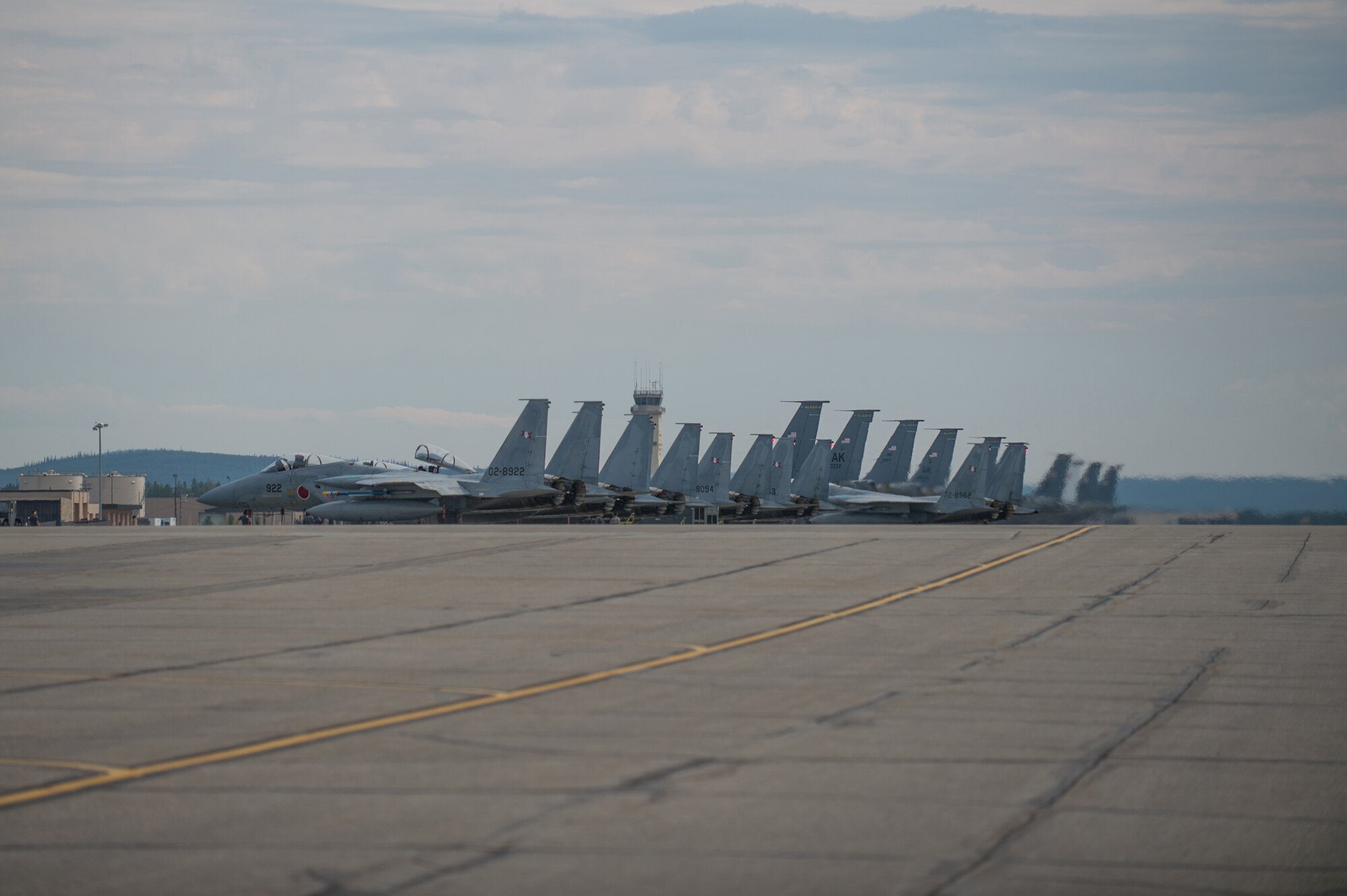 Japan Air Self-Defense Force (JASDF) F-15J Eagles prepare to take off from Eielson Air Force Base, Alaska, Aug. 14, 2015, during RED FLAG-Alaska (RF-A) 15-3. JASDF and Republic of Korea Air Force units are deployed to Eielson along with assorted tanker, transport, fighter and electronic warfare aircraft, and support personnel from multiple U.S. service branches for RF-A, a series of Pacific Air Forces commander-directed field training exercises for U.S. and partner nation forces, providing combined offensive counter-air, interdiction, close air support, and large force employment training in a simulated combat environment. (U.S. Air Force photo by Staff Sgt. Shawn Nickel/Released)