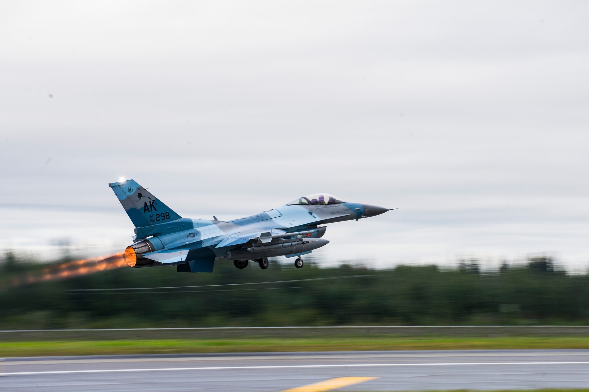 A U.S. Air Force F-16 Fighting Falcon assigned to the 18th Aggressor Squadron takes off from Eielson Air Force Base, Alaska, Aug. 20, 2015, during RED FLAG-Alaska (RF-A) 15-3. RF-A is a series of Pacific Air Forces commander-directed field training exercise for U.S. and partner nation forces, providing combined offensive counter-air, interdiction, close air support and large force employment training in a simulated combat environment. (U.S. Air Force photo by Staff Sgt. Joshua Turner/Released)