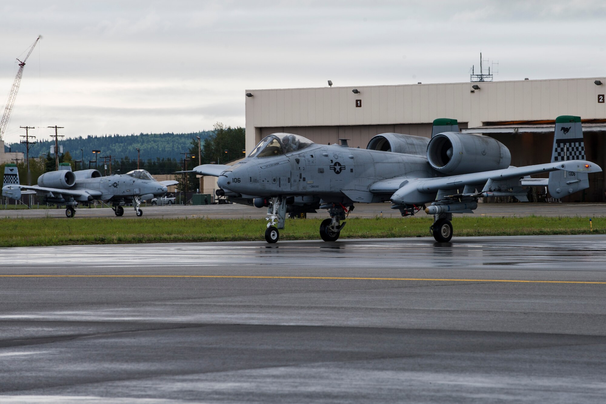 U.S. Air Force A-10 Thunderbolt II aircraft with the 25th Fighter Squadron from Osan Air Base, Republic of Korea, taxi on the Eielson Air Force Base, Alaska, flightline Aug. 20, 2015, during RED FLAG-Alaska (RF-A) 15-3. RF-A is a series of Pacific Air Forces commander-directed field training exercise for U.S. and partner nation forces, providing combined offensive counter-air, interdiction, close air support and large force employment training in a simulated combat environment. (U.S. Air Force photo by Staff Sgt. Joshua Turner/Released)
