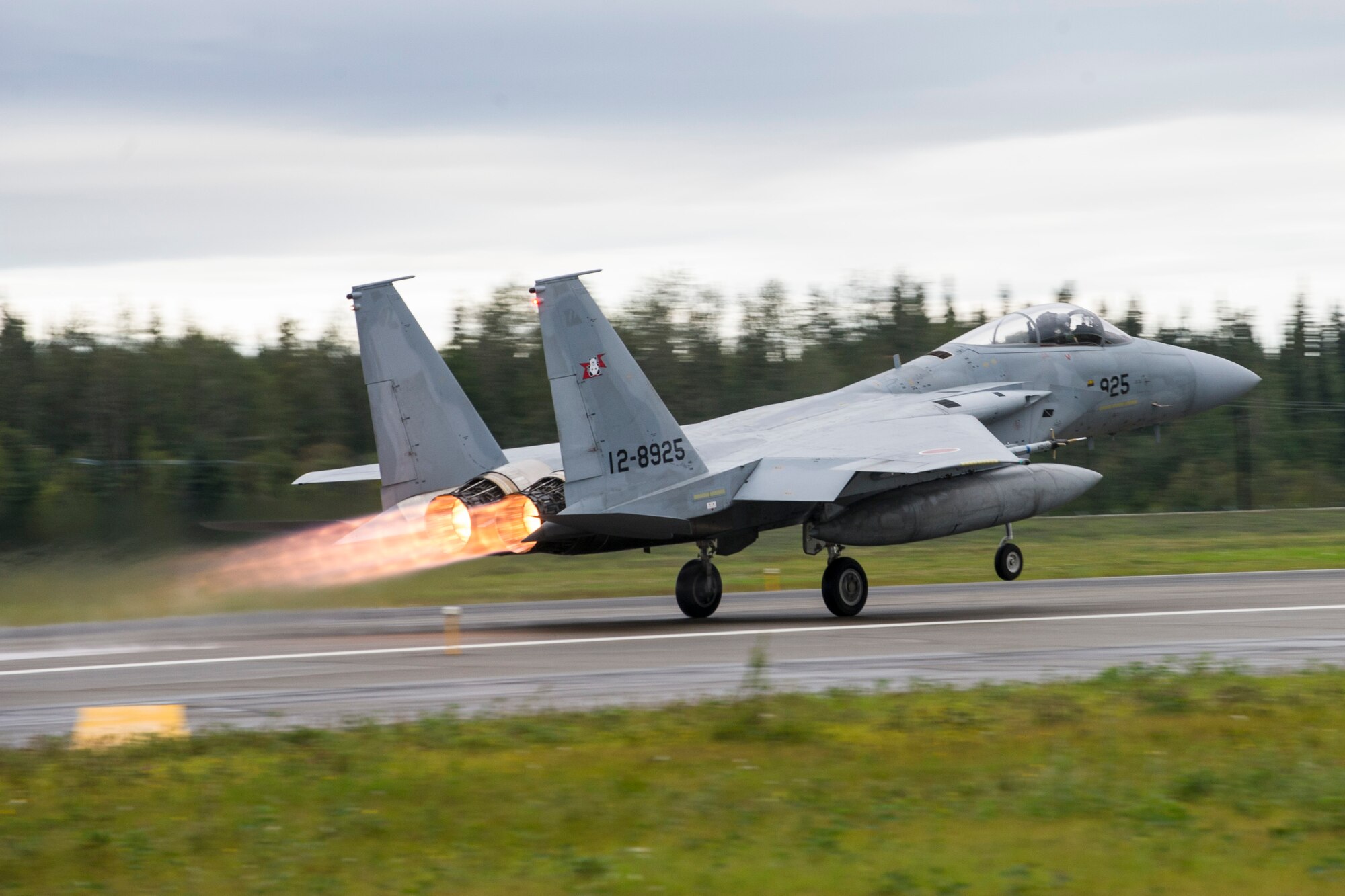 A Japan Air Self-Defense Force (JASDF) F-15J Eagle takes off from Eielson Air Force Base, Alaska, Aug. 20, 2015, during RED FLAG-Alaska (RF-A) 15-3. JASDF and Republic of Korea Air Force units are deployed to Eielson along with assorted aircraft and support personnel from multiple service branches for RF-A, a series of Pacific Air Forces commander-directed field training exercise for U.S. and partner nation forces, providing combined offensive counter-air, interdiction, close air support, and large force employment training in a simulated combat environment. (U.S. Air Force photo by Staff Sgt. Joshua Turner/Released)