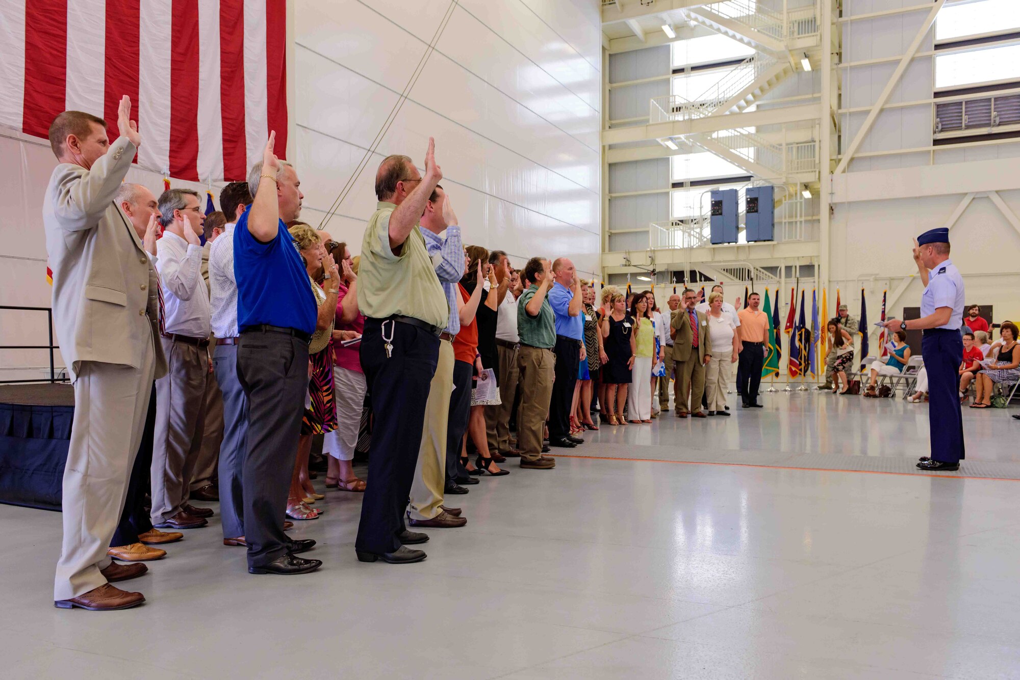 Col. Frederick D. Thaden, Joint Base McGuire-Dix-Lakehurst and 87th Air Base
Wing commander, swears in Honorary Commanders during an induction ceremony
held in the U.S. Navy Fleet Logistics Support Squadron 64 hangar Aug. 19,
2015, at Joint Base McGuire-Dix-Lakehurst, N.J.  The Honorary Commander
program encourages an exchange
of ideas, experiences and friendships between key leaders of the surrounding
communities and JB MDL.  (U.S. Air Force photo by Robert Williard/Released)
