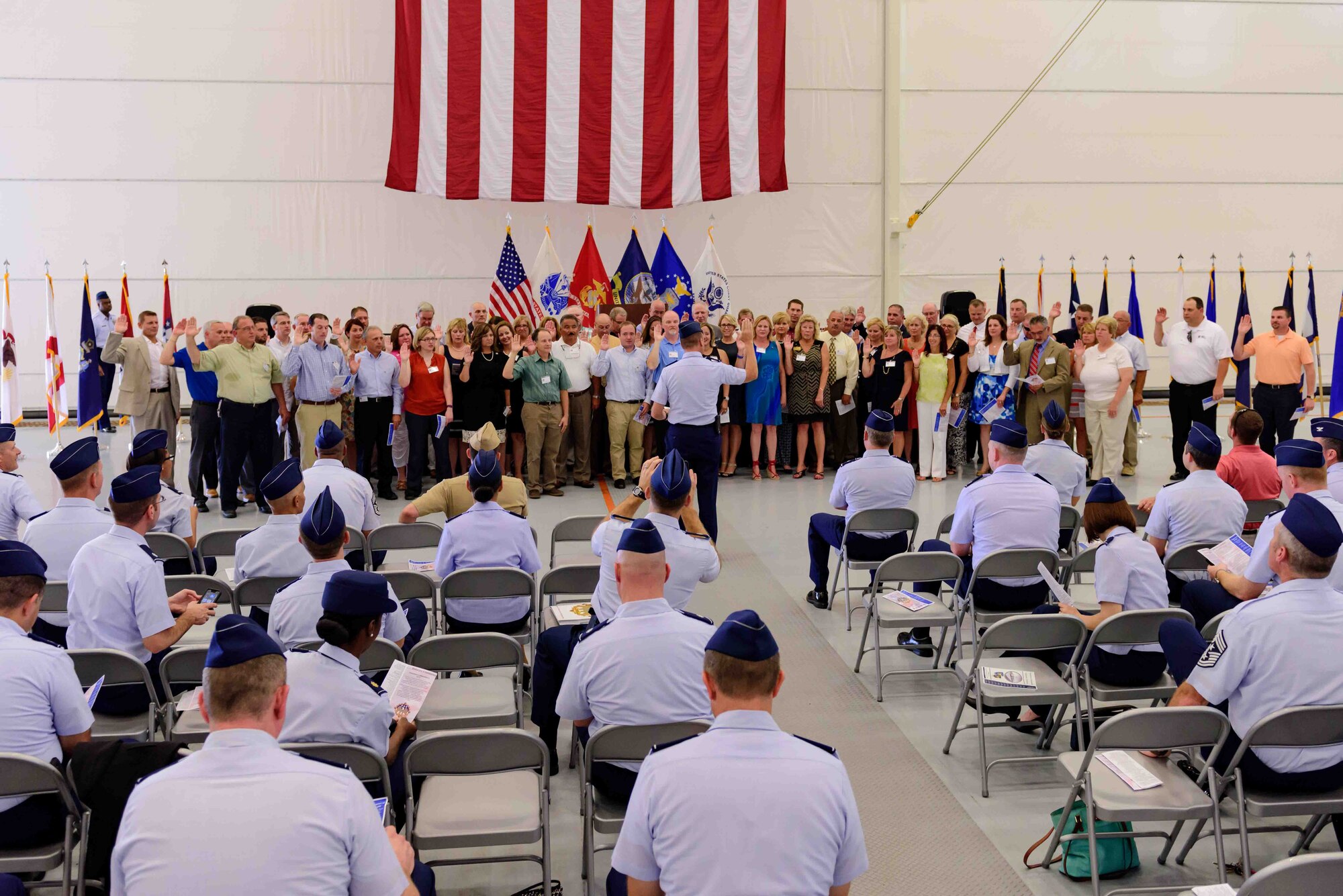 Col. Frederick D. Thaden, Joint Base McGuire-Dix-Lakehurst and 87th Air Base
Wing commander, swears in Honorary Commanders during an induction ceremony
held in the U.S. Navy Fleet Logistics Support Squadron 64 hangar Aug. 19,
2015, at Joint Base McGuire-Dix-Lakehurst, N.J.  The Honorary Commander
program encourages an exchange
of ideas, experiences and friendships between key leaders of the surrounding
communities and JB MDL.  (U.S. Air Force photo by Robert Williard/Released)
