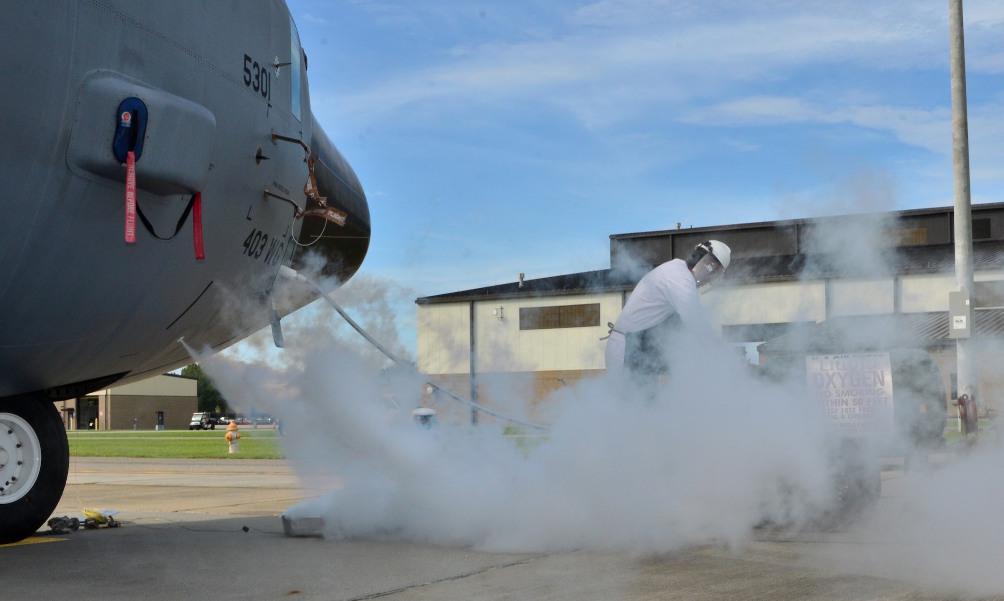 Tech. Sgt. Clinton Nicholas, a crew chief with the 403rd Aircraft Maintenance Squadron, refills the liquid oxygen on a WC-130J before its deployment to collect weather data in the Atlantic Ocean for the National Hurricane Center, Aug. 19, 2015. (U.S. Air Force Photo/Master Sgt. Brian Lamar)
