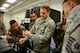 U.S. Air Force Staff Sgt. Ian Douglas, 355th Equipment Maintenance Squadron nondestructive inspections lab journeyman, teaches members of the Honduran Air Force how to conduct ultrasonic testing during a subject matter expert exchange event on Davis-Monthan AFB, Ariz., Aug. 19, 2015. Ultrasonic Testing uses ultrasonic vibrations to detect internal defects, delaminations, disbonds, and discontinuities. The five members from the Honduran Air Force teamed up with 12th Air Force (Air Forces Southern) and the 355th EMS for a subject matter expert exchange that focused on a variety of nondestructive inspections lab processes and maintenance safety standards. (U.S. Air Force photo by Tech. Sgt. Heather Redman/Released)