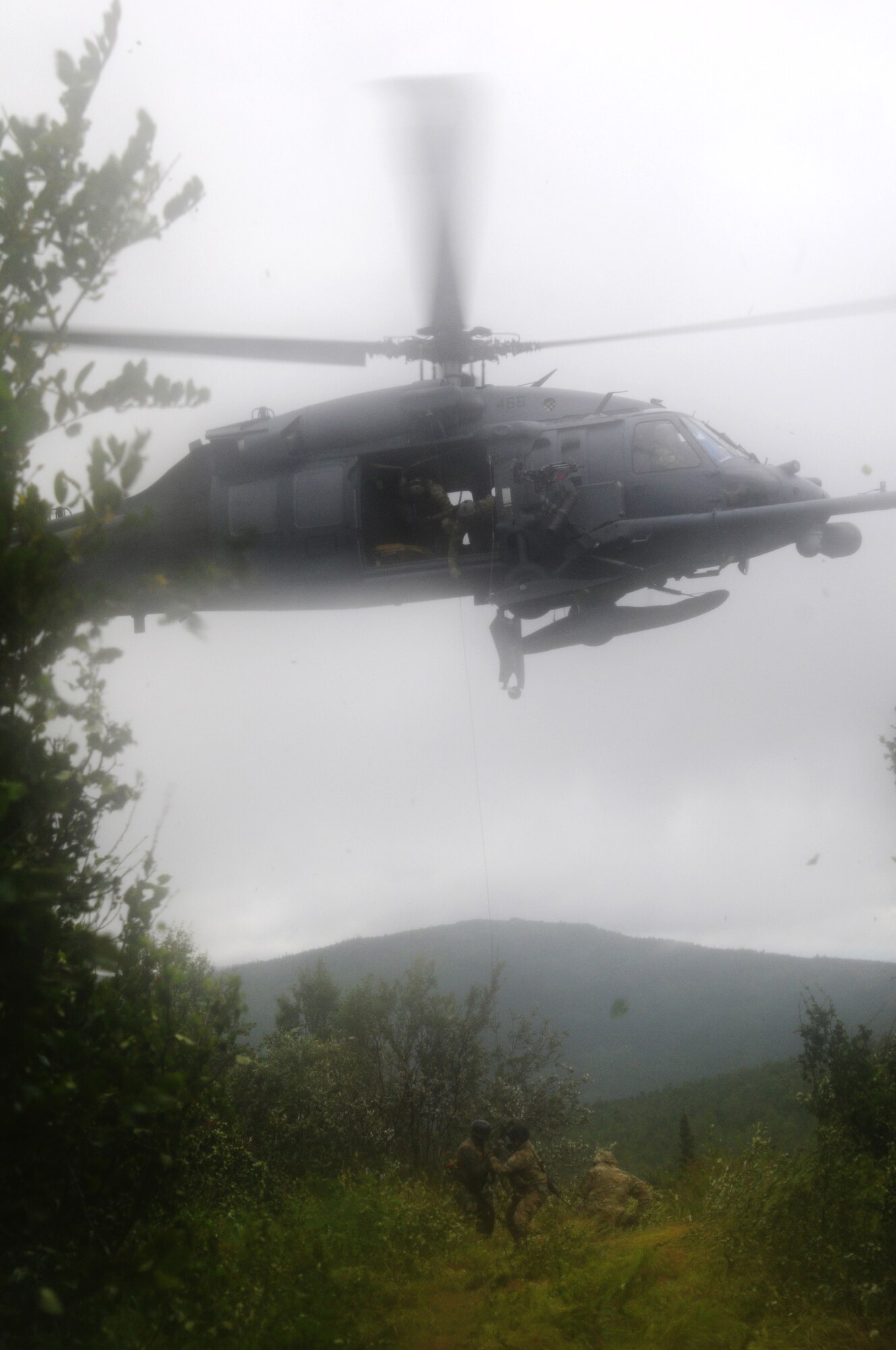 U.S. Air Force Airmen from the Alaska Air National Guard's 210th and 212th Rescue Squadrons rescue a pilot during an isolated personnel recovery exercise Aug. 13, 2015, at Eielson Air Force Base, Alaska, as part of RED FLAG-Alaska (RF-A) 15-3.  RF-A is a Pacific Air Forces commander-directed field training exercise for U.S. and partner nation forces, providing combined offensive counter-air, interdiction, close air support and large force employment training in a simulated combat environment.  (U.S. Air Force photo by Master Sgt. Ralph Kapustka/Released)
