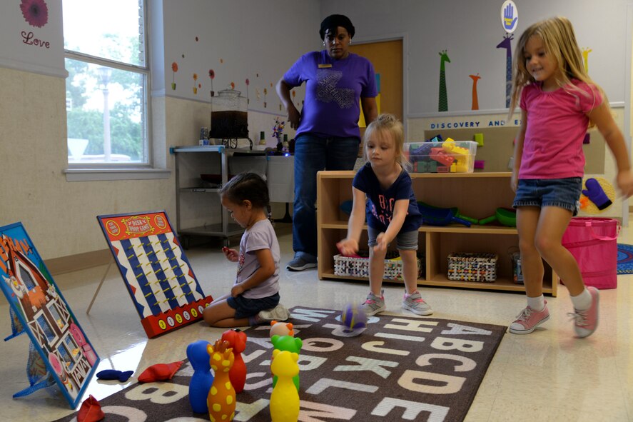 Children engage in activities following the opening of the new Child Development Center gross motor classroom at Barksdale Air Force Base, La., Aug. 20, 2015. The activities develop children’s major muscle groups to include the arms, legs and torso. (U.S. Air Force photo/Senior Airman Jannelle Dickey)