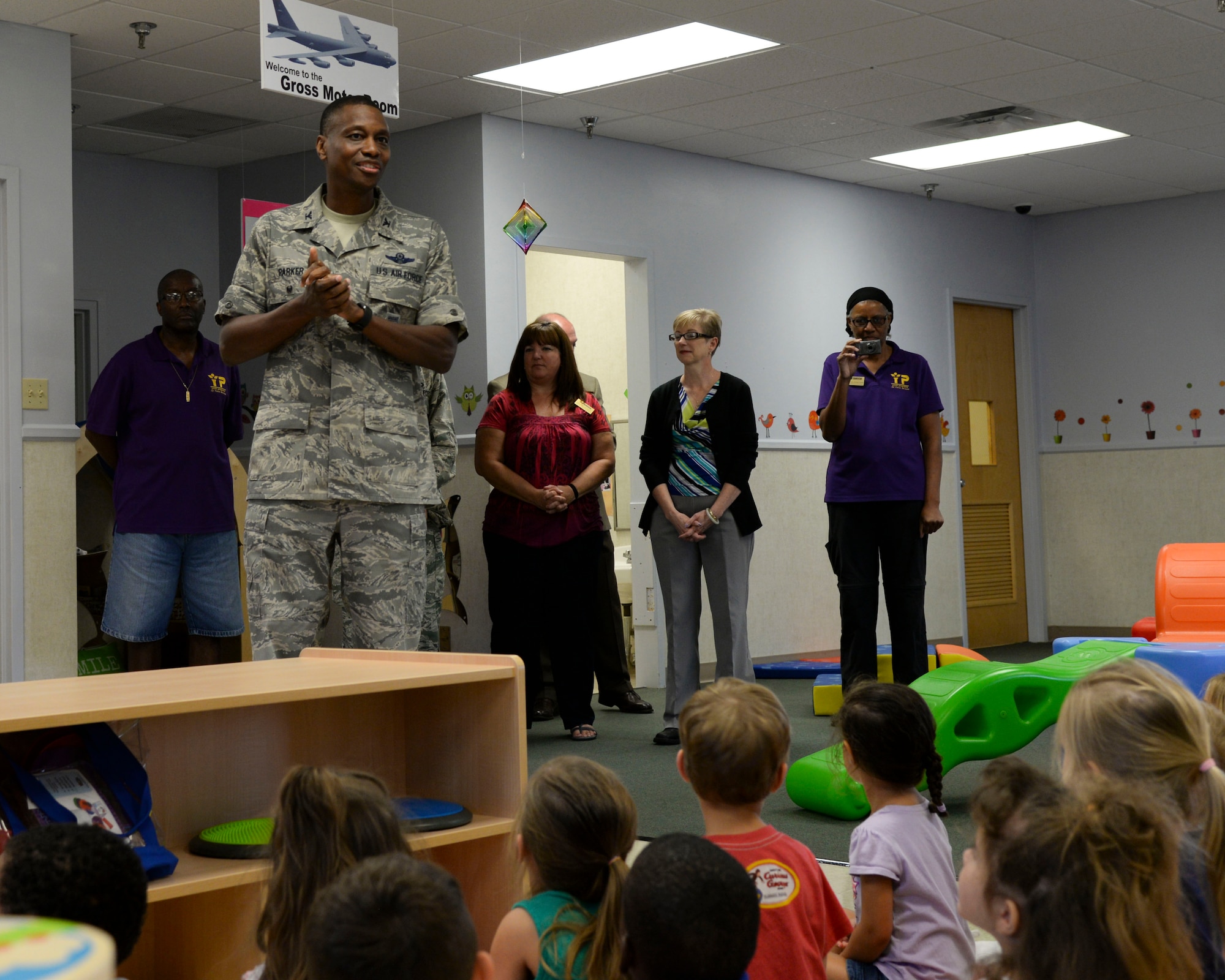 Col. Brandon Parker, 2nd Bomb Wing vice commander, gives opening remarks during the Child Development Center’s gross motor classroom ribbon cutting ceremony at Barksdale Air Force Base, La., Aug. 20, 2015. The new classroom provides the opportunity for children to develop their major muscle groups and gross motor skills, in addition to having a designated area for fun activities during extreme weather conditions. (U.S. Air Force photo/Senior Airman Jannelle Dickey)