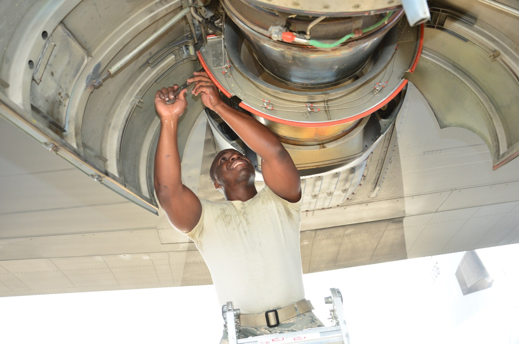 Senior Airman Gerold Harbin, an aerospace propulsion journeyman, with the 403rd Aircraft Maintenance Squadron, tightens loose screws on a WC-130J engine before a 53rd Weather Reconnaissance Squadron deployment to assist the Central Pacific Hurricane Center with weather reconnaissance missions in the Pacific Ocean. (U.S. Air Force Photo/ Master Sgt. Brian Lamar)
