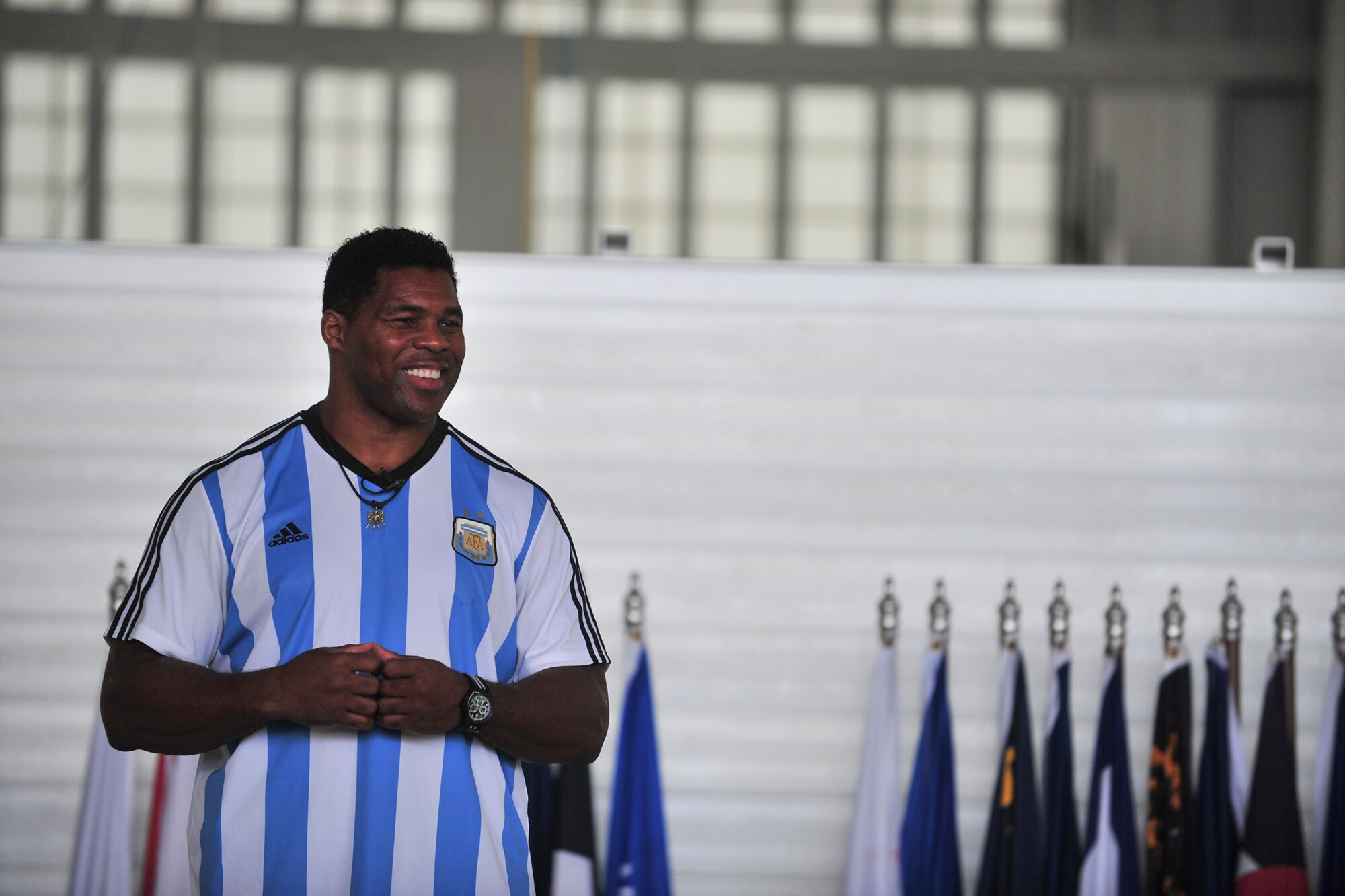 Herschel Walker talks to Team Minot about resiliency during his visit to Minot Air Force Base, N.D., Aug. 19, 2015. Walker shared stories about his battle with aggression, childhood bullies and his respect for the men and women of the United States military. Walker is a retired professional football player and while at the University of Georgia, was awarded the Heisman Trophy in 1982.  (U.S. Air Force photo/Staff Sgt. Malia Jenkins) 