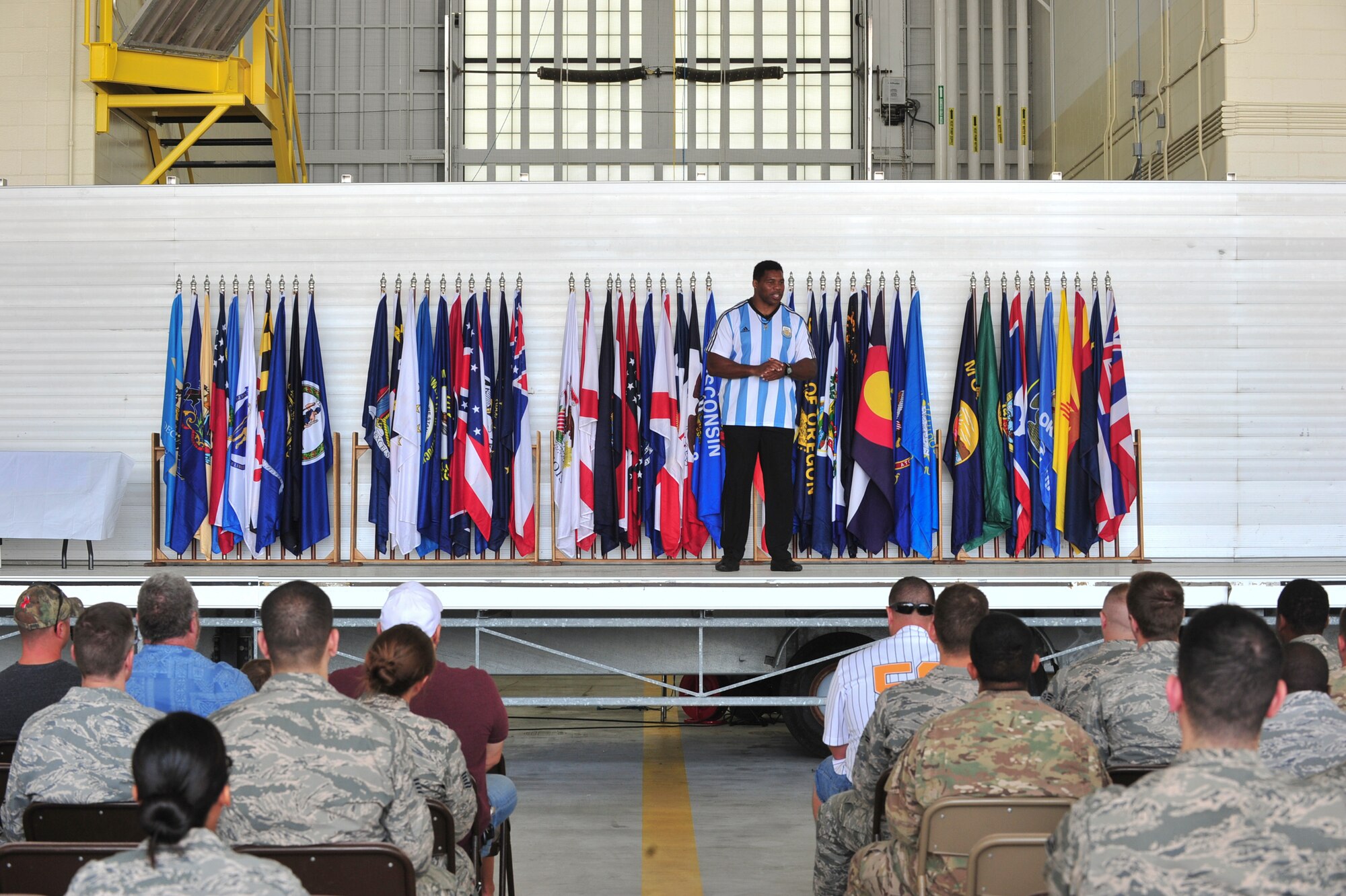 Herschel Walker talks to Team Minot about resiliency during his visit to Minot Air Force Base, N.D., Aug. 19, 2015. Walker shared stories about his battle with aggression, childhood bullies and his respect for the men and women of the United States military. Walker is a retired professional football player and while at the University of Georgia, was awarded the Heisman Trophy in 1982.  (U.S. Air Force photo/Staff Sgt. Malia Jenkins) 