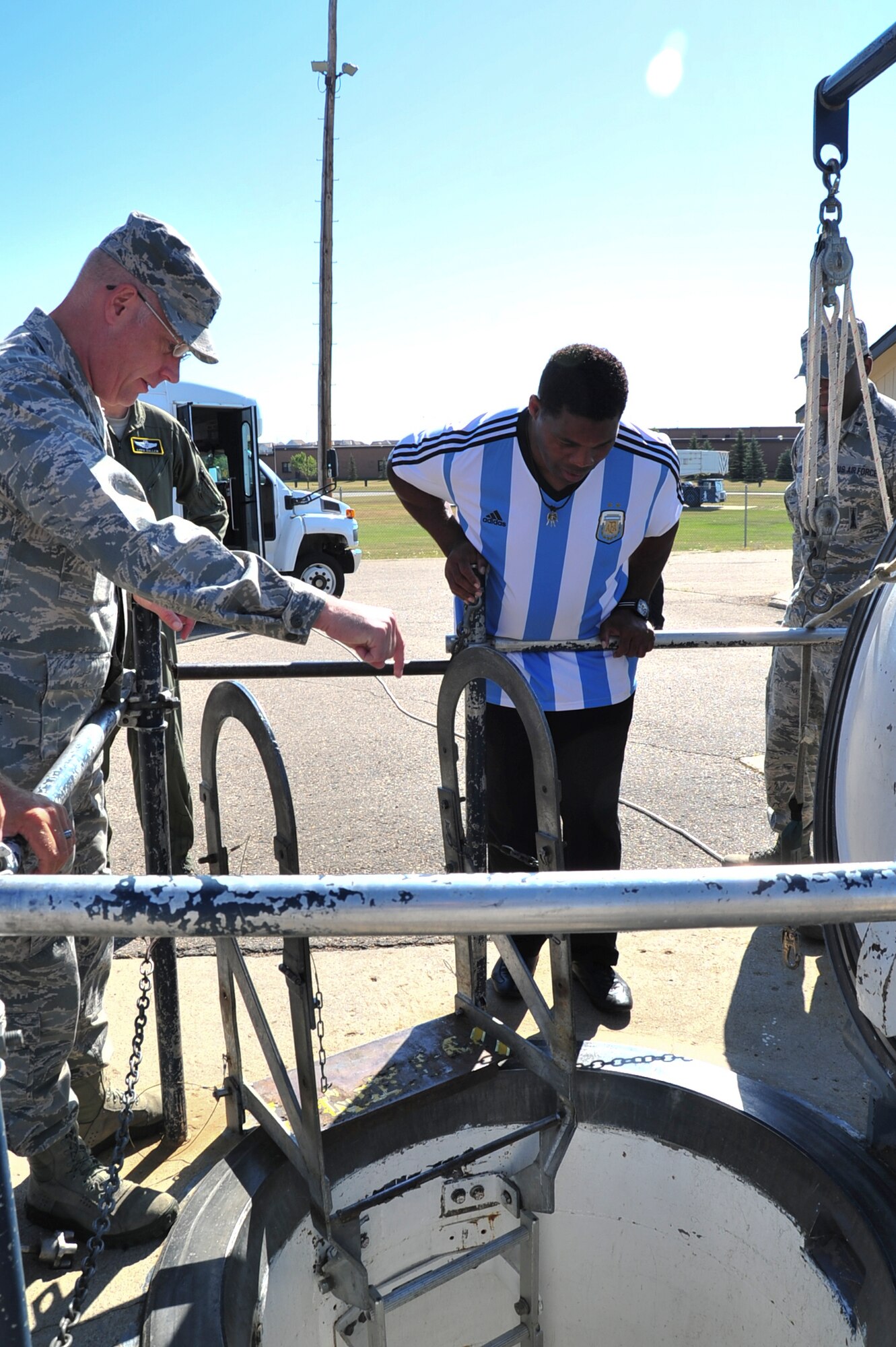 Herschel Walker looks into an inert missile capsule entrance during his visit to Minot Air Force Base, N.D., Aug. 19, 2015. Walker visited the base to share his message of resiliency and how he overcame his hardships to be the man he is today. (U.S. Air Force photo/Staff Sgt. Malia Jenkins)