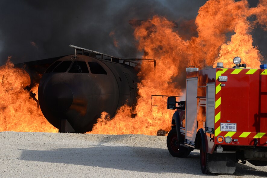 Laughlin firefighters use a P-34 Rapid Intervention Vehicle to extinguish the flames during an aircraft live-fire training exercise on Laughlin Air Force Base, Texas, Aug. 19, 2015. The P-34 RIV uses state-of-the-art ultra-high pressure firefighting technology that uses smaller water droplets to cover more area with less water. (U.S. Air Force Photo by Airman 1st Class Brandon May) (Released)