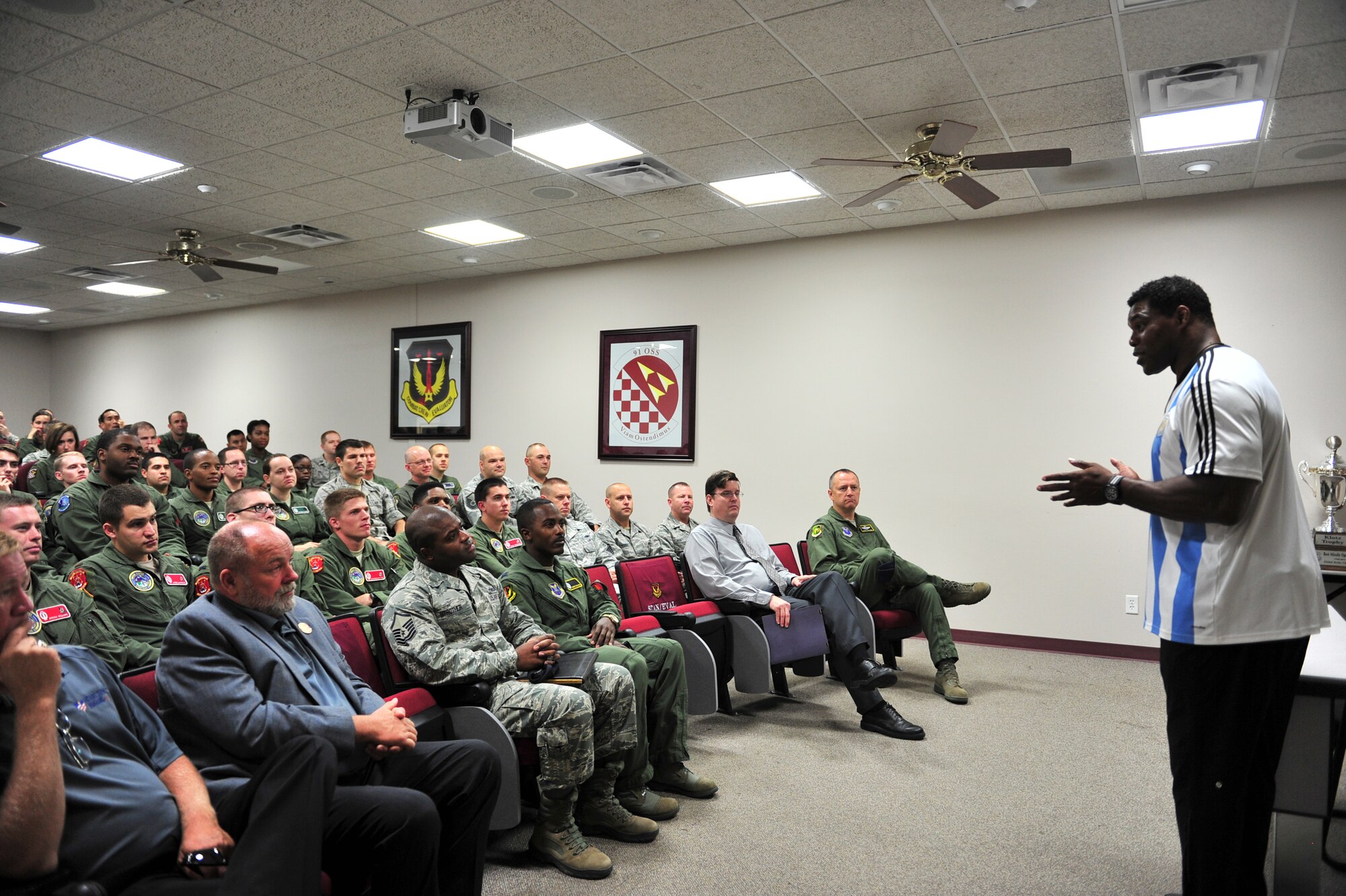 Herschel Walker talks to members from the 91st Operations Group about resiliency during his visit to Minot Air Force Base, N.D., Aug. 19, 2015. Walker visited the base to share his message of resiliency and how he overcame his hardships to be the man he is today. (U.S. Air Force photo/Staff Sgt. Malia Jenkins)