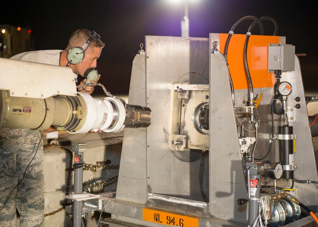Tech. Sgt. Steve Manning, 660th Aircraft Maintenance Squadron from Travis AFB, California, checks for alignment between the KC-10 boom and Boeing's boom test unit Aug. 8. The 418th Flight Test Squadron received ogistical support from Scott Air Force Base, Illinois, maintainers from Travis AFB, California, air crew support from Air Force Reserve Command and 10 Boeing employees from Seattle. At any given time, there were at least 16 different pieces of ground equipment being used for the test. (U.S. Air Force photo by Brad White)
