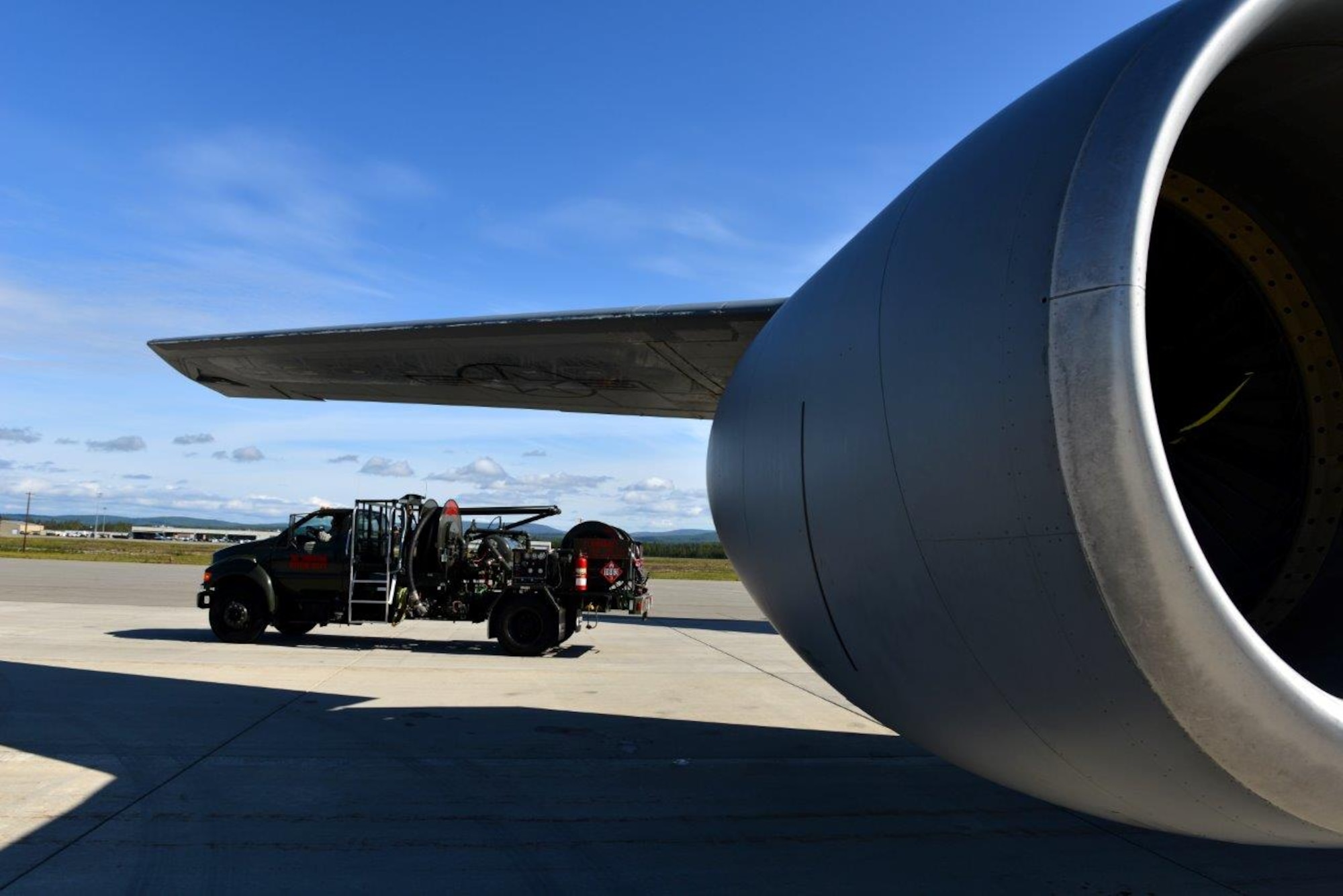 Fuel trucks like this R-12 model are the primary means by which the 354th Logistics Readiness Squadron petroleum, oil, and lubrication flight refuel aircraft on the flightline as quickly as possible so they can prepare for their next RED FLAG-Alaska 15-3 sortie. The fuels flight here has refined this process down to the point of creating a response time of less than two minutes. (U.S. Air Force photo by Airman 1st Class Kyle Johnson)