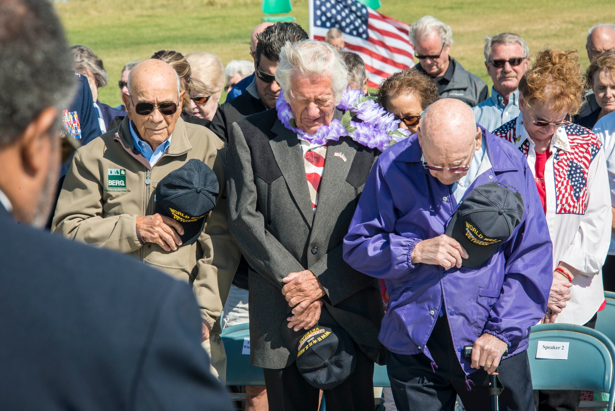 World War II veterans and others in attendance bow their heads during the invocation praying for their fallen comrades who weren’t able to be with them that day as part of a commemoration ceremony for the 70th anniversary to the end of World War II Aug. 15, 2015, at the Washington State Veterans Cemetery in Medical Lake, Wash. During times of turmoil and war, mankind always looks to religion and religious figures for comfort, especially those serving in military units. Today, military chaplains continue aiding the men and women serving in uniform with spiritual and moral support. (U.S. Air Force photo/Staff Sgt. Benjamin W. Stratton)
